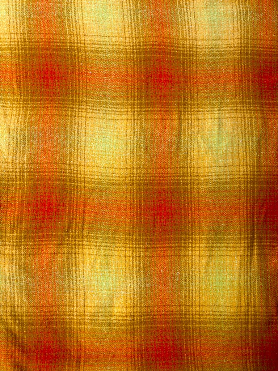 yellow and orange coloured vintage blanket