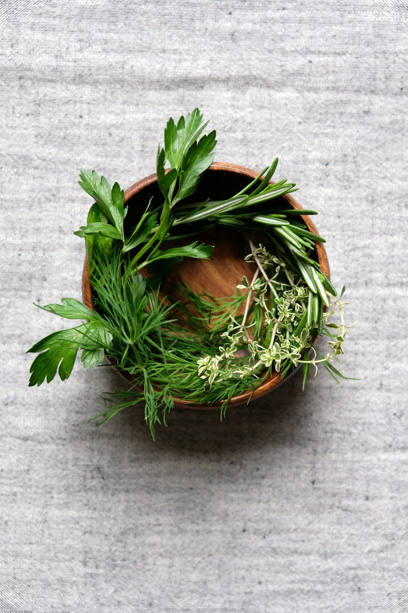 Herbs in a wooden bowl