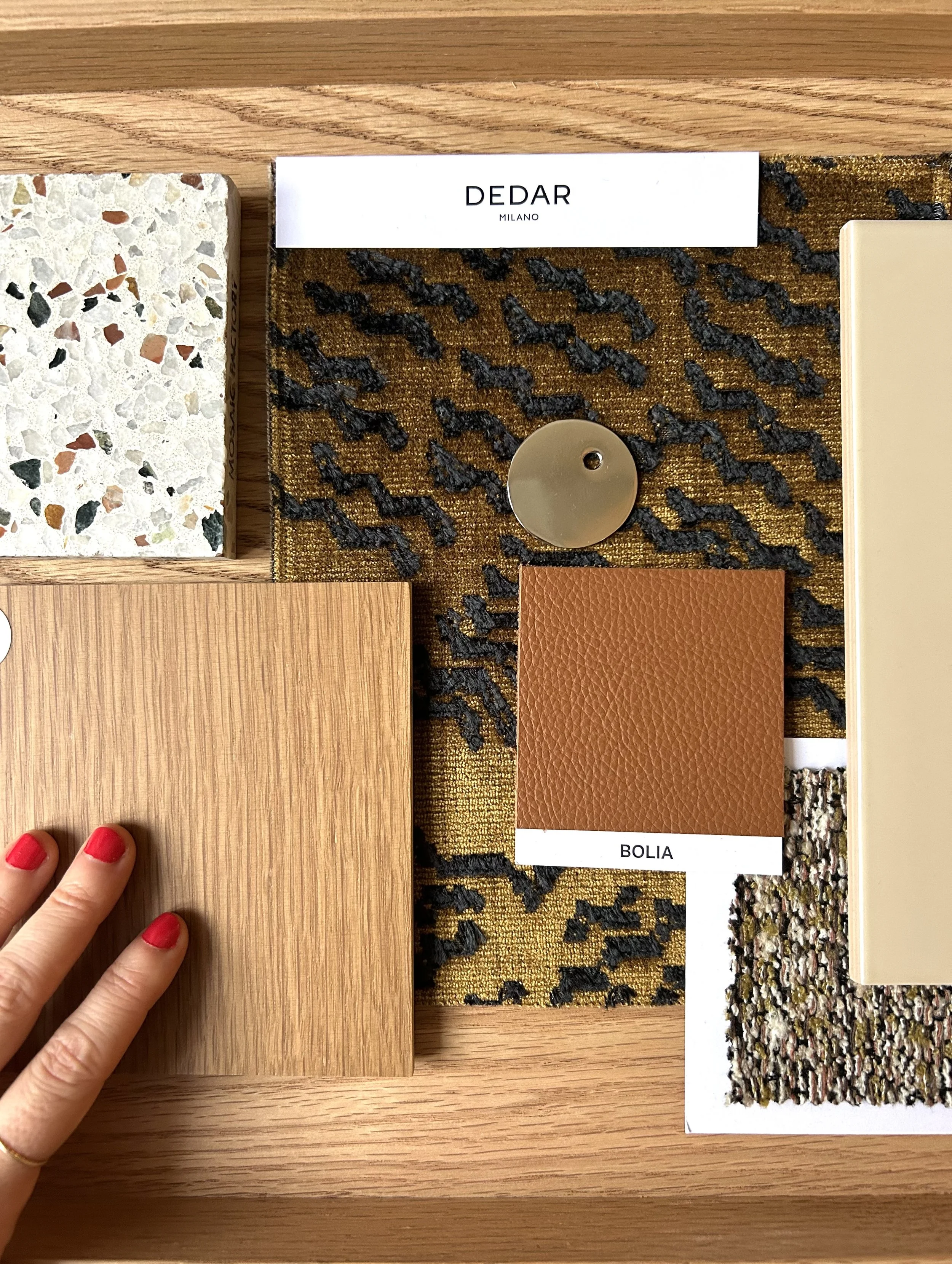 material board with light brown and beige colours, dedar fabric, leather and terrazzo