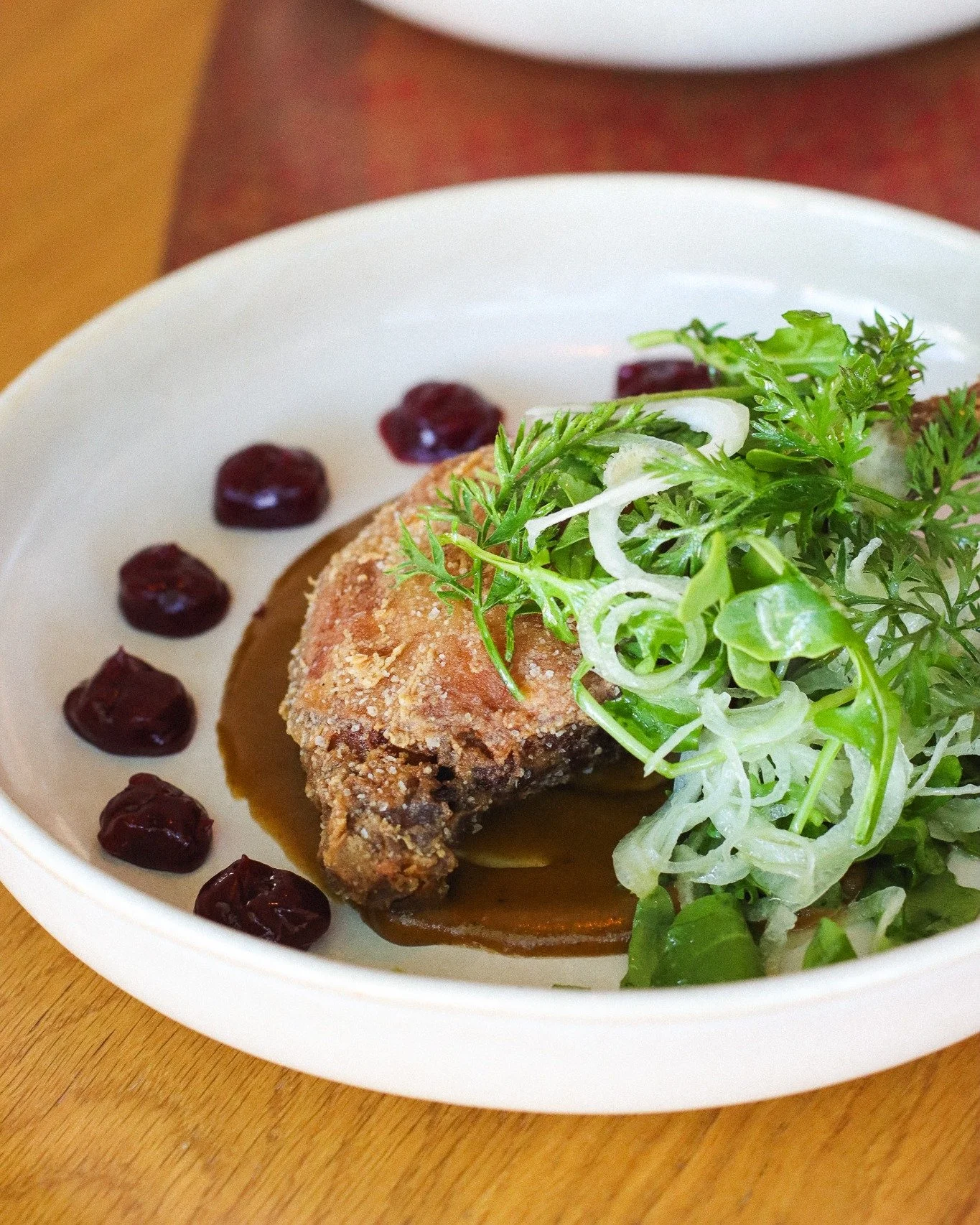 Chef's Crispy Campfire Duck Leg... think PB&amp;J, but all grown up. 

Cold-smoked and confit in bread garum and duck fat, then fried for the perfect crackle. Served with togarashi cashew butter, huckleberry gel, cipollini onions, and simply dressed 