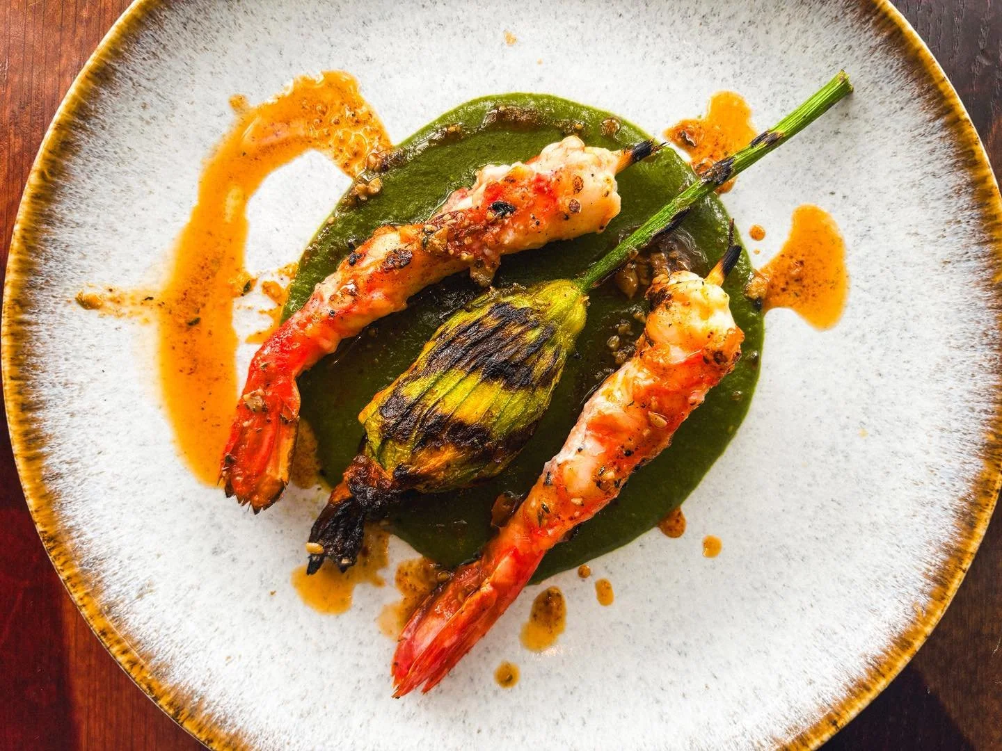 Grilled Alaskan Spot Prawn with a shrimp farce-stuffed squash blossom, brushed with ramp butter and finished with a sauce of dandelion greens.

A limited special, here for just a few weeks. Photographed so well we had to add it your feed. 

..

😃 Ha