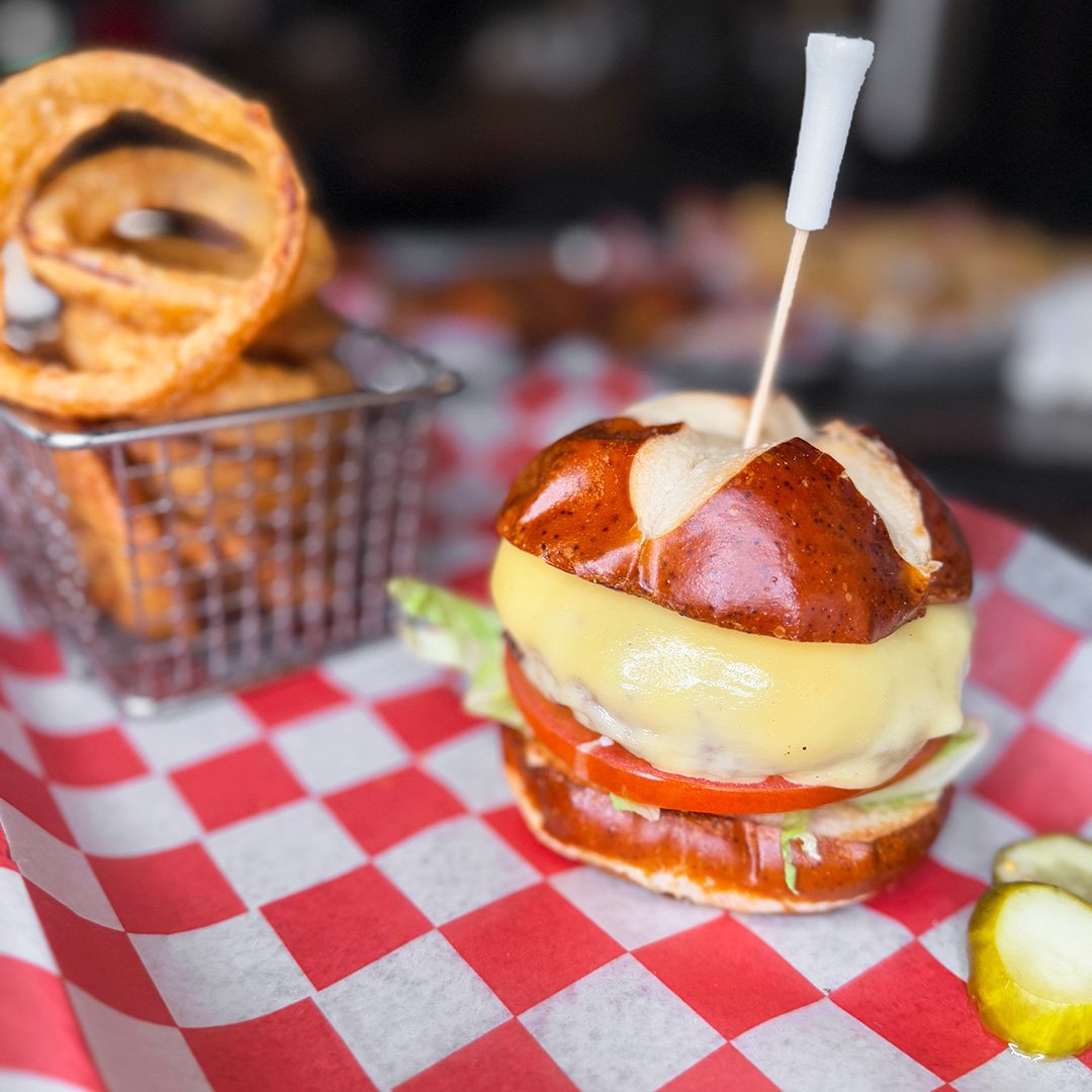 This burger and onion ring duo didn&rsquo;t come to play&mdash;they came to slay your hunger. And no, we&rsquo;re not responsible if you start dreaming about them later. Handle with caution: they&rsquo;re dangerously delicious. See menu, link in bio.