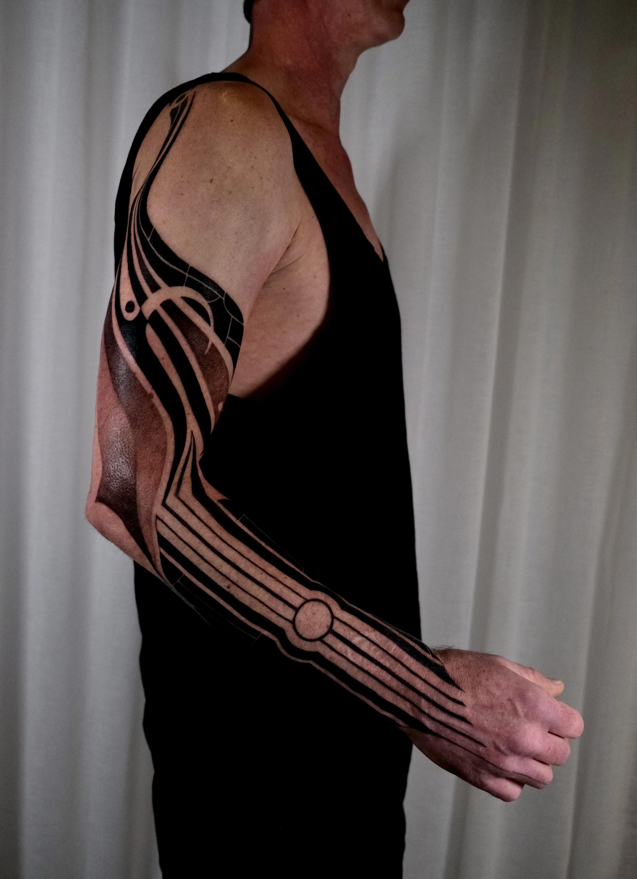 blackwork graphic tattoo sleeve
