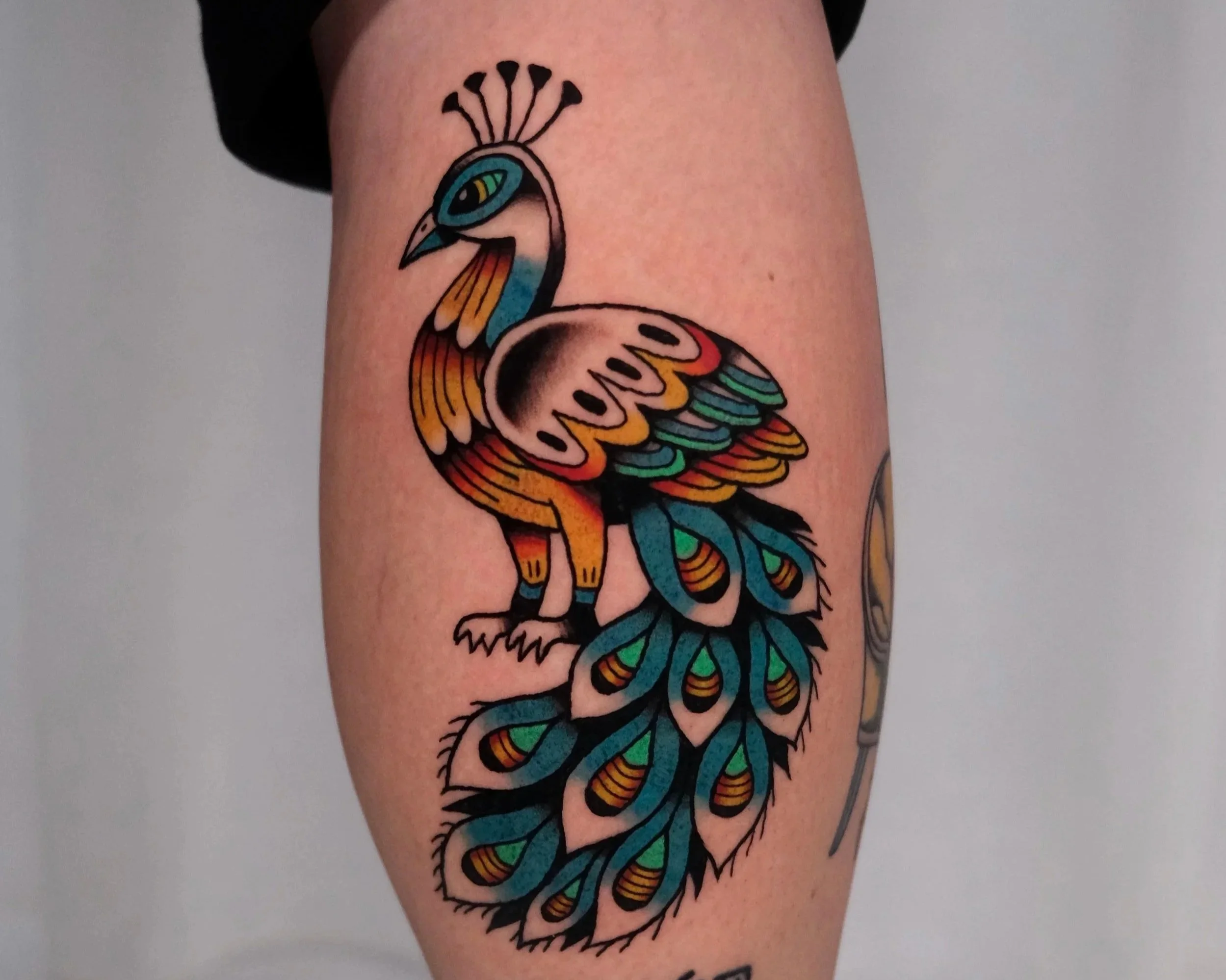 kleurrijke pauw tattoo