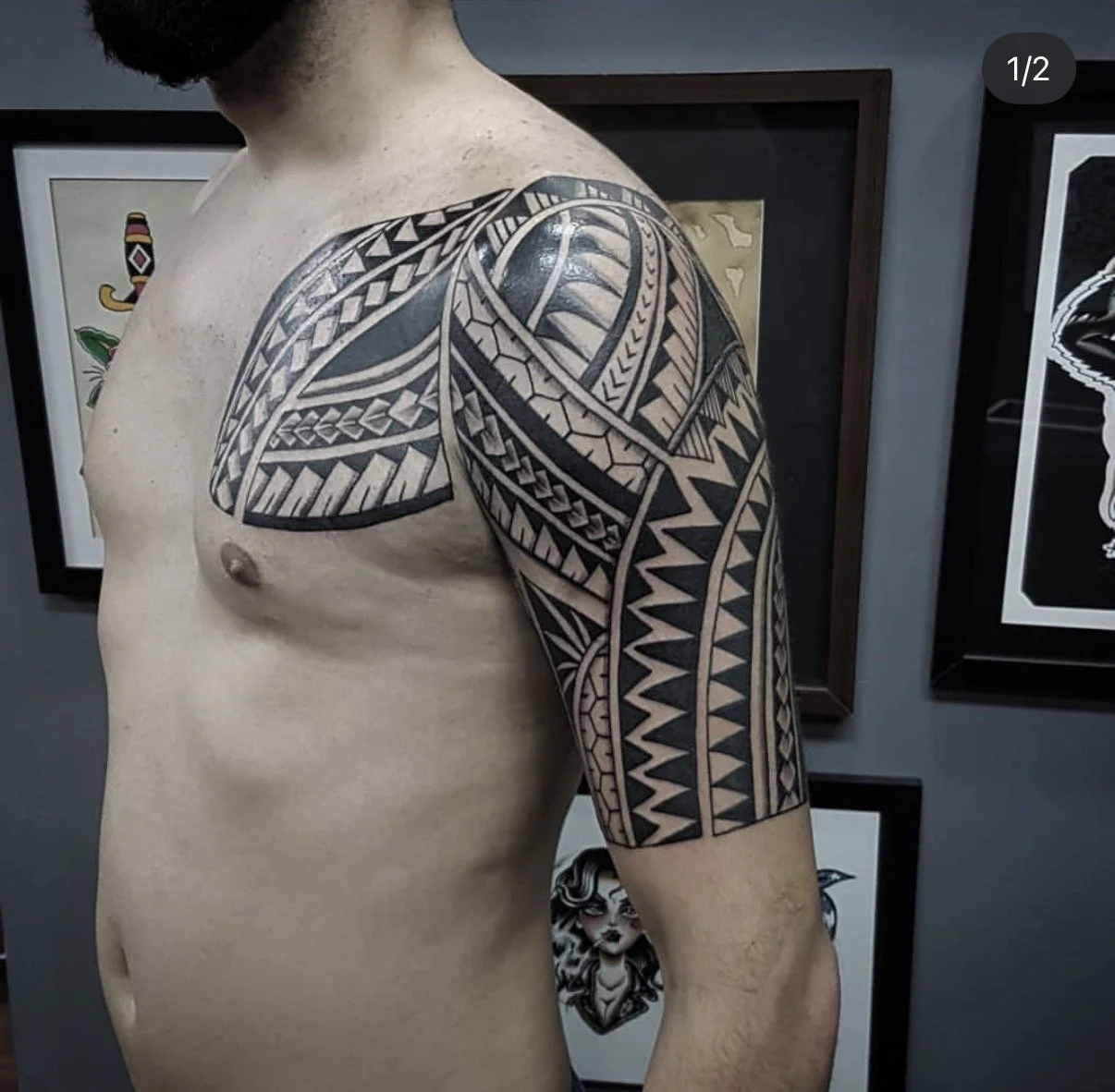 polynesian chest upper arm tattoo