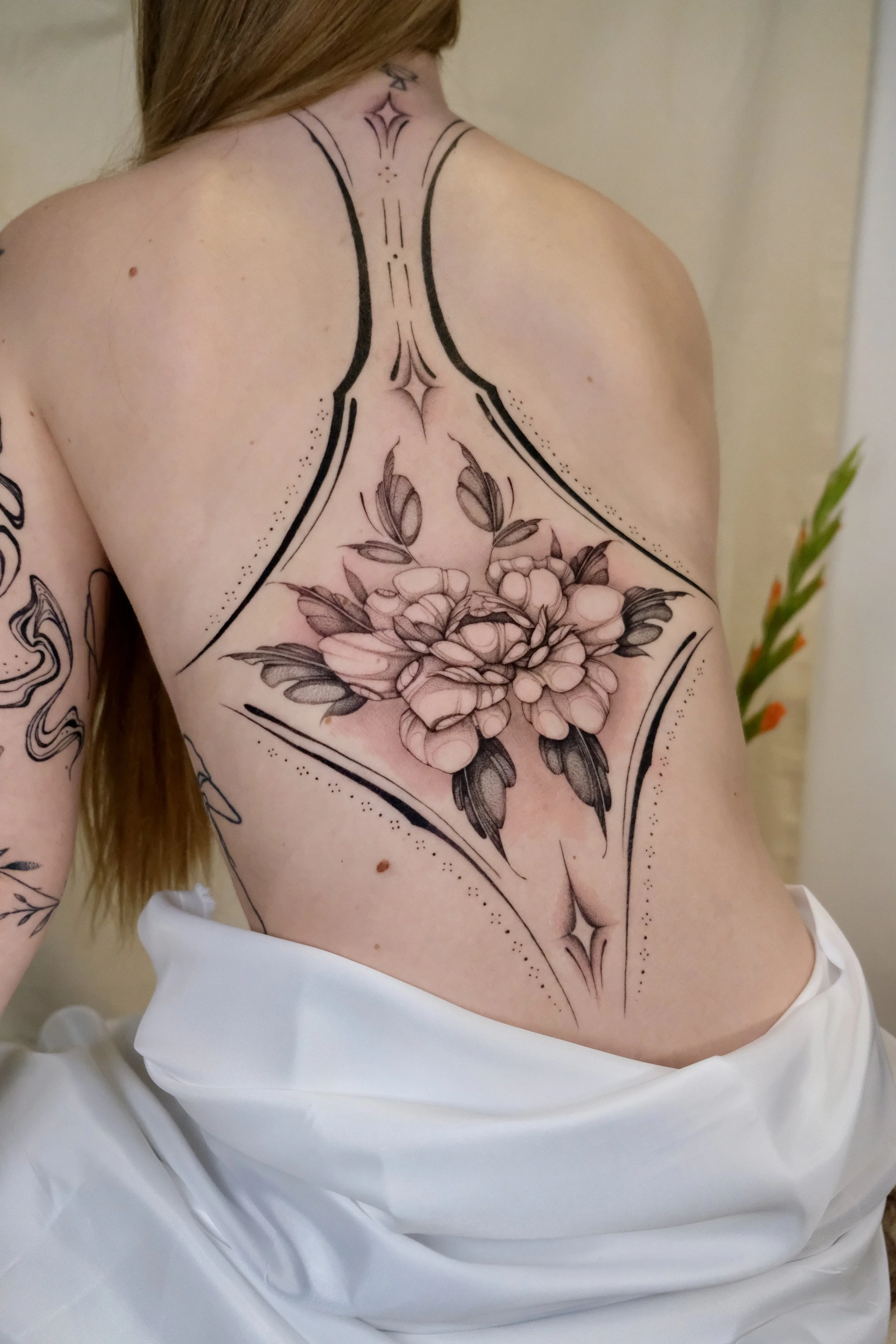 bloemen rug tattoo