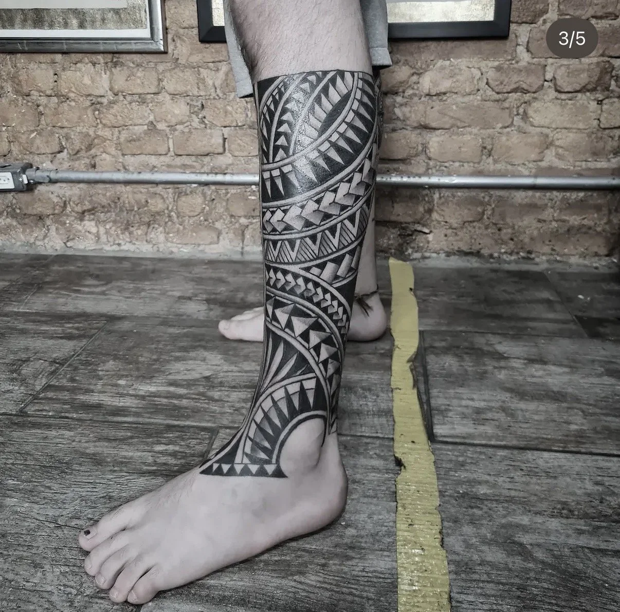 big polynesian leg tattoo