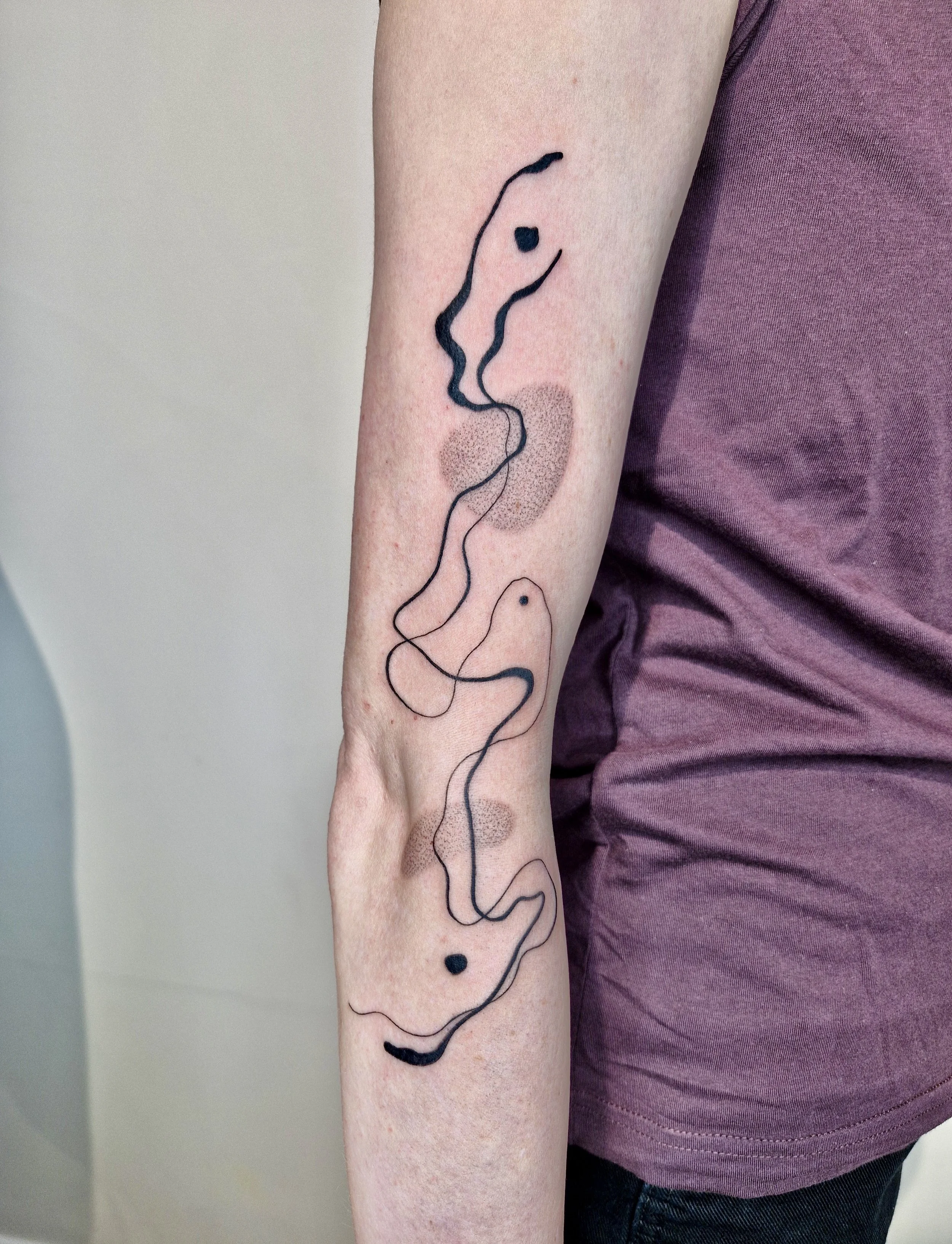 flowy abstract tattoo