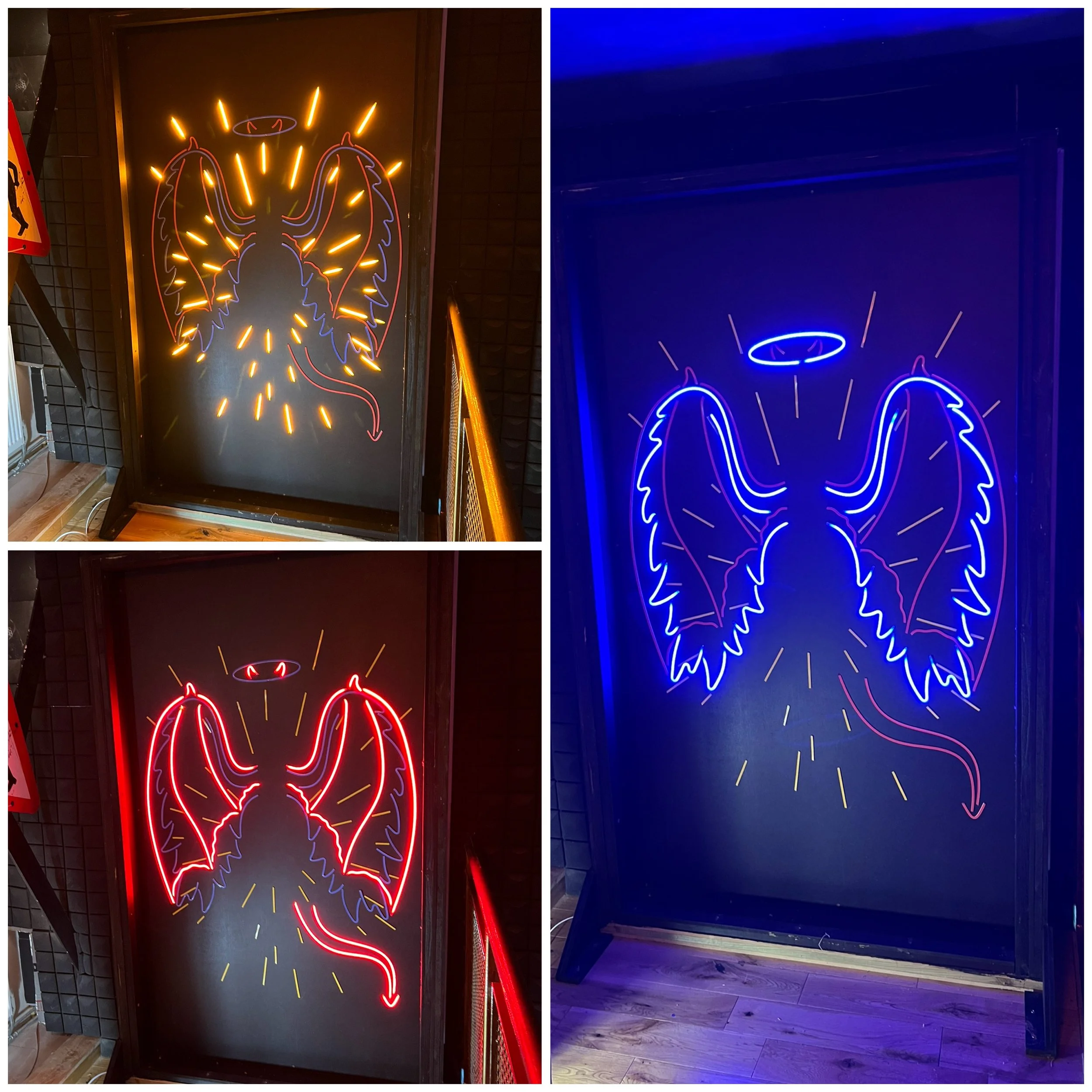 Colorful neon signs of angel wings with a halo and a tail, depicted in yellow, blue, and red lights.