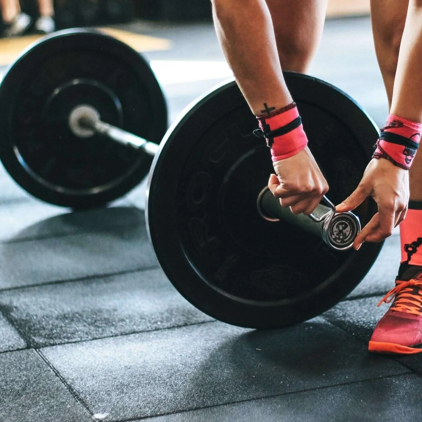 weightlifter pink trainers setting weights how heavy strength and conditioning training session