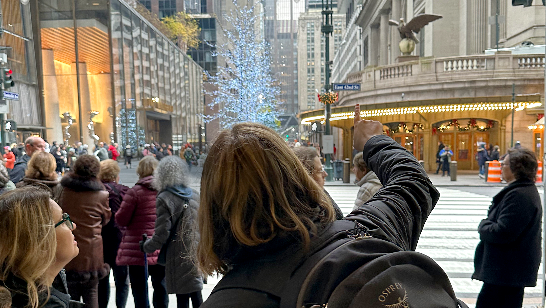 Tour guide pointing to details on Grand Central Terminal