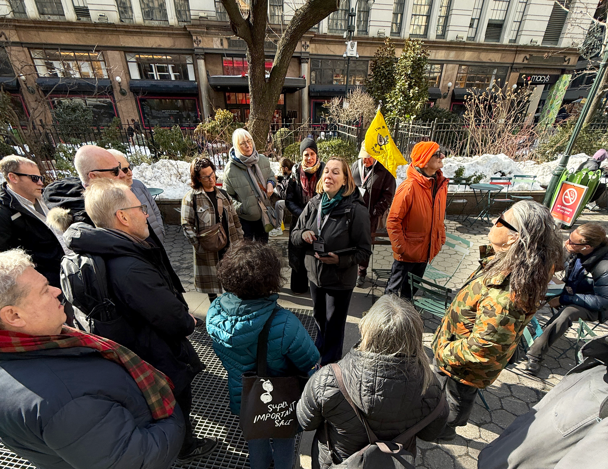 High angle view of a tour guide presenting information to tour guests.