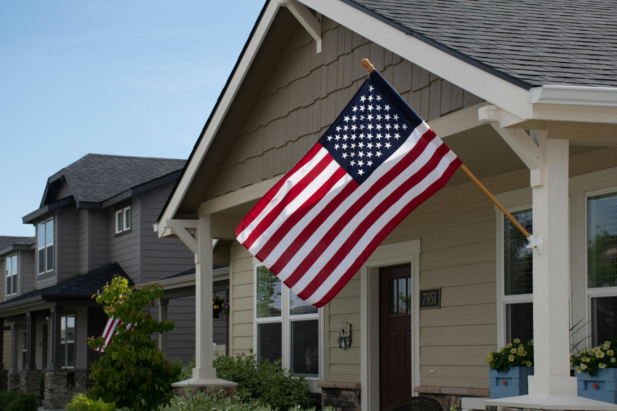 home in a nice neighborhood with american flag