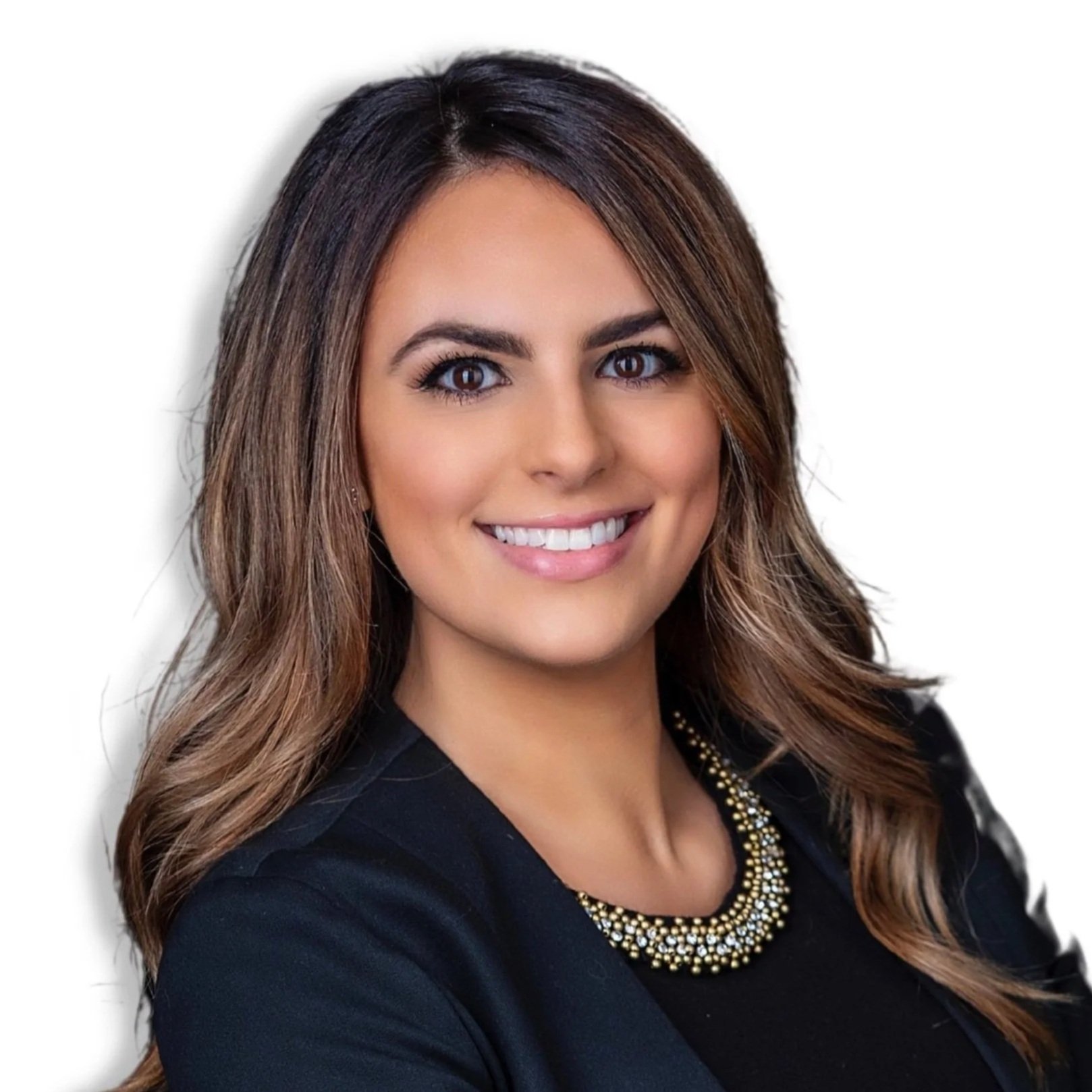 Smiling woman with long brown hair wearing a black blazer and beaded necklace against a white background.