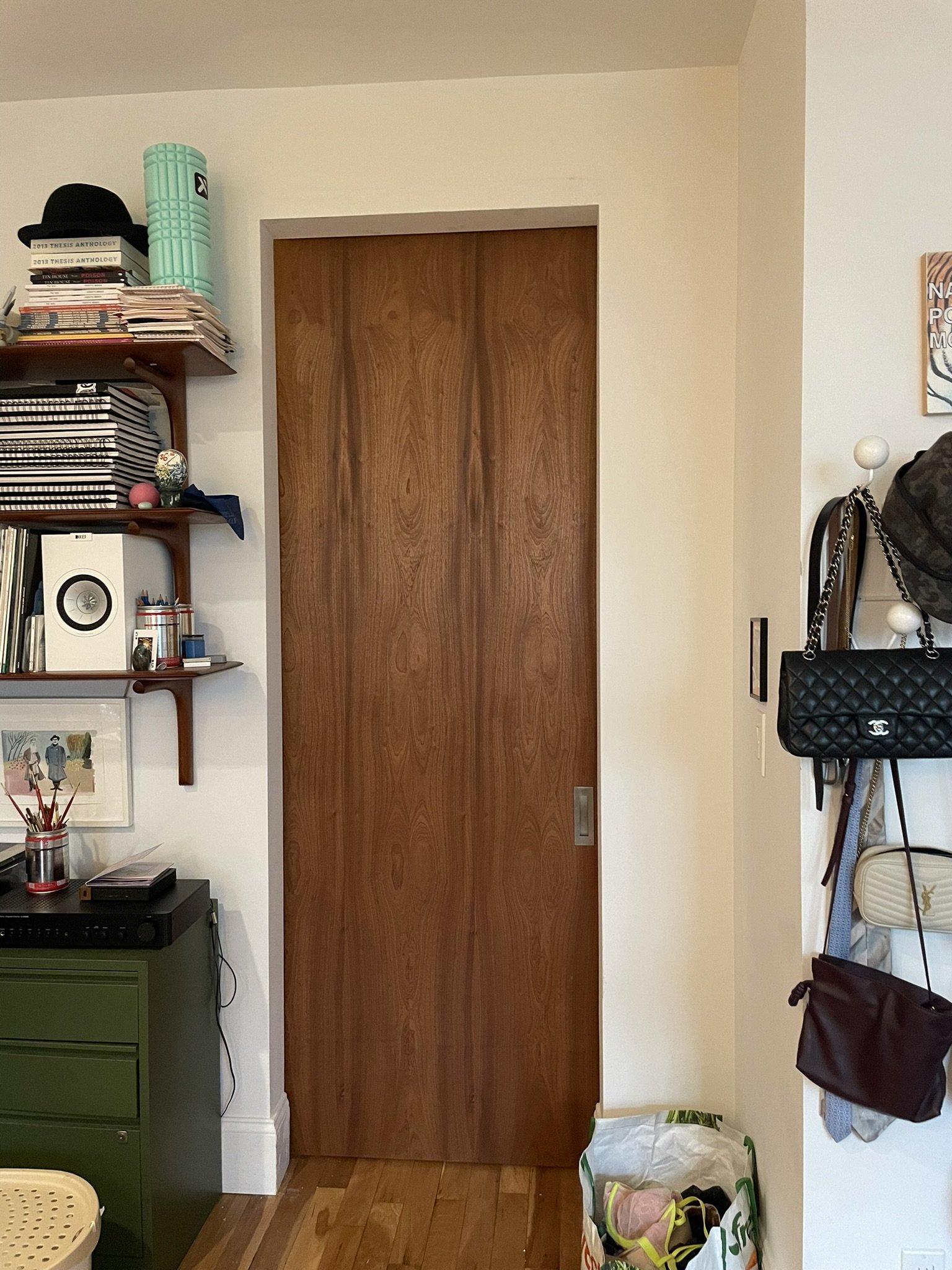 Custom sliding door with finishes to match rooms on each side. 