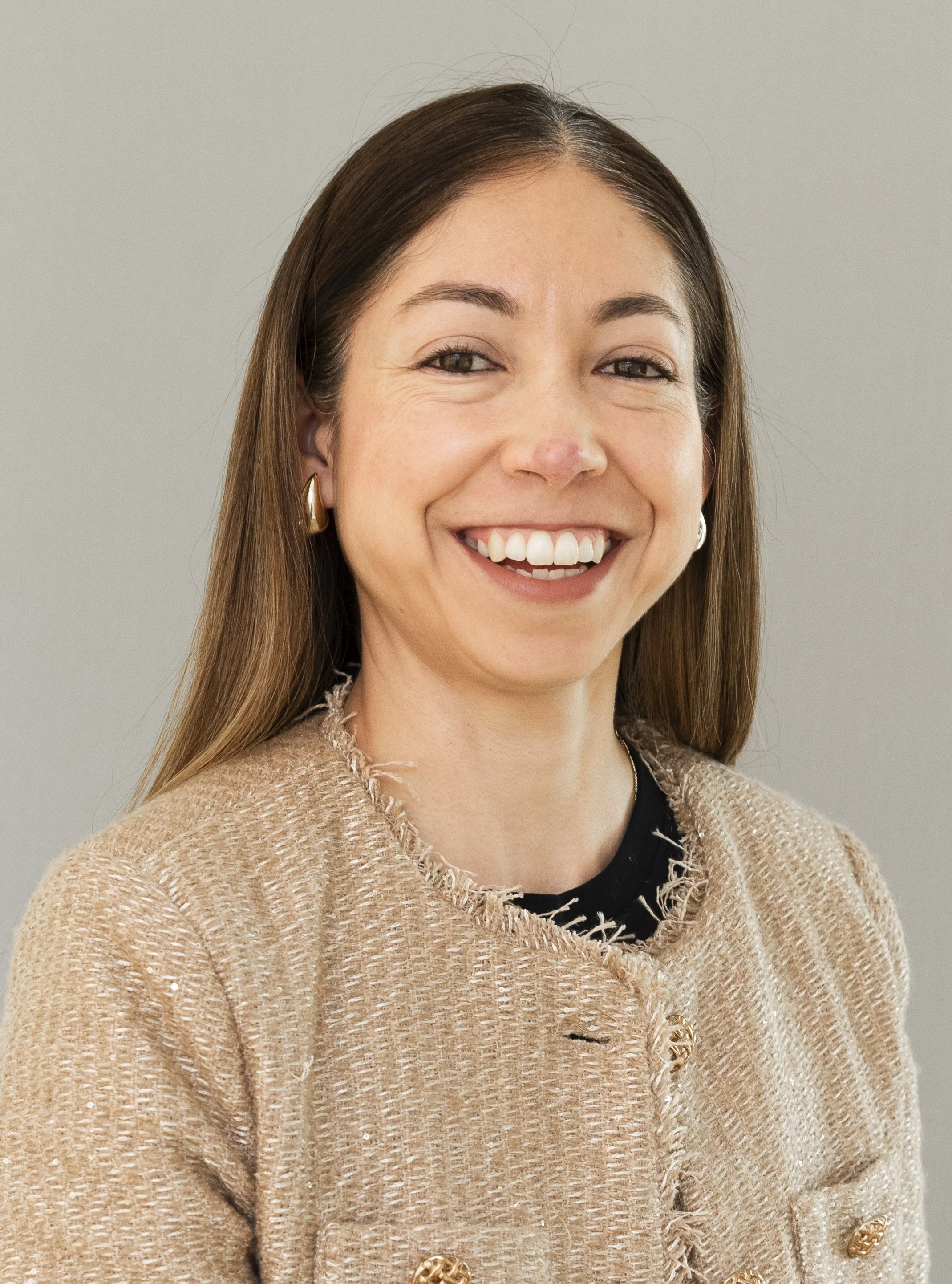 woman long brown hair smiling white background