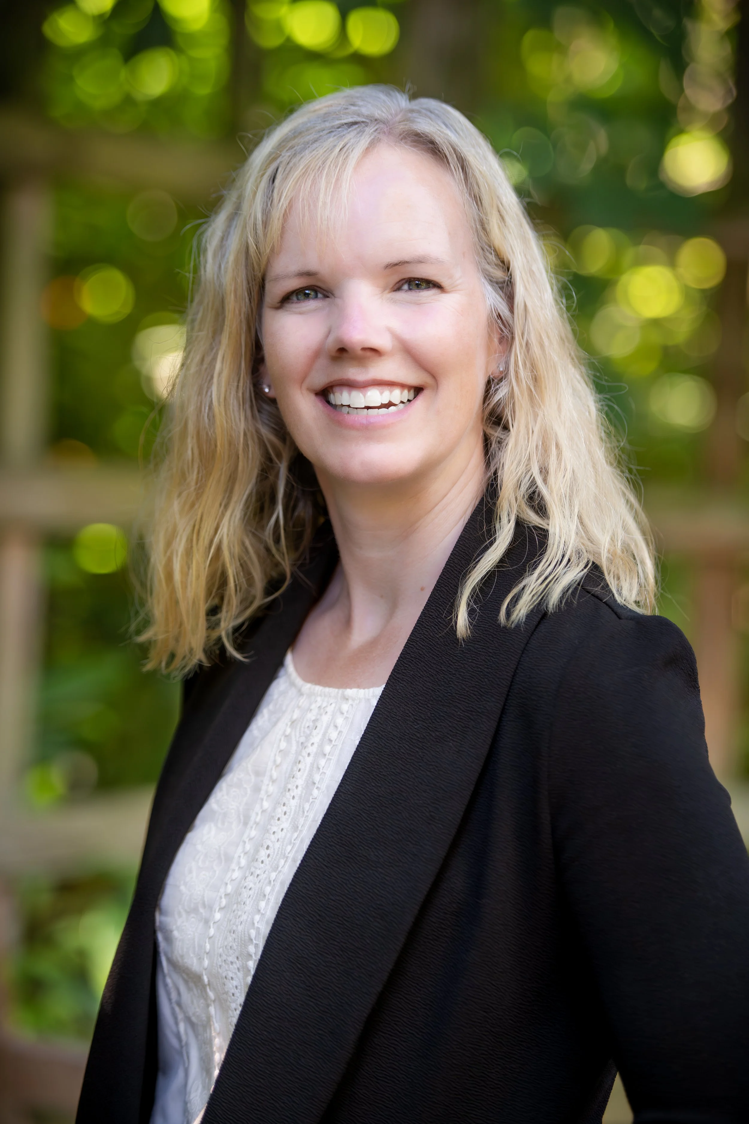 Woman smiling into the camera.