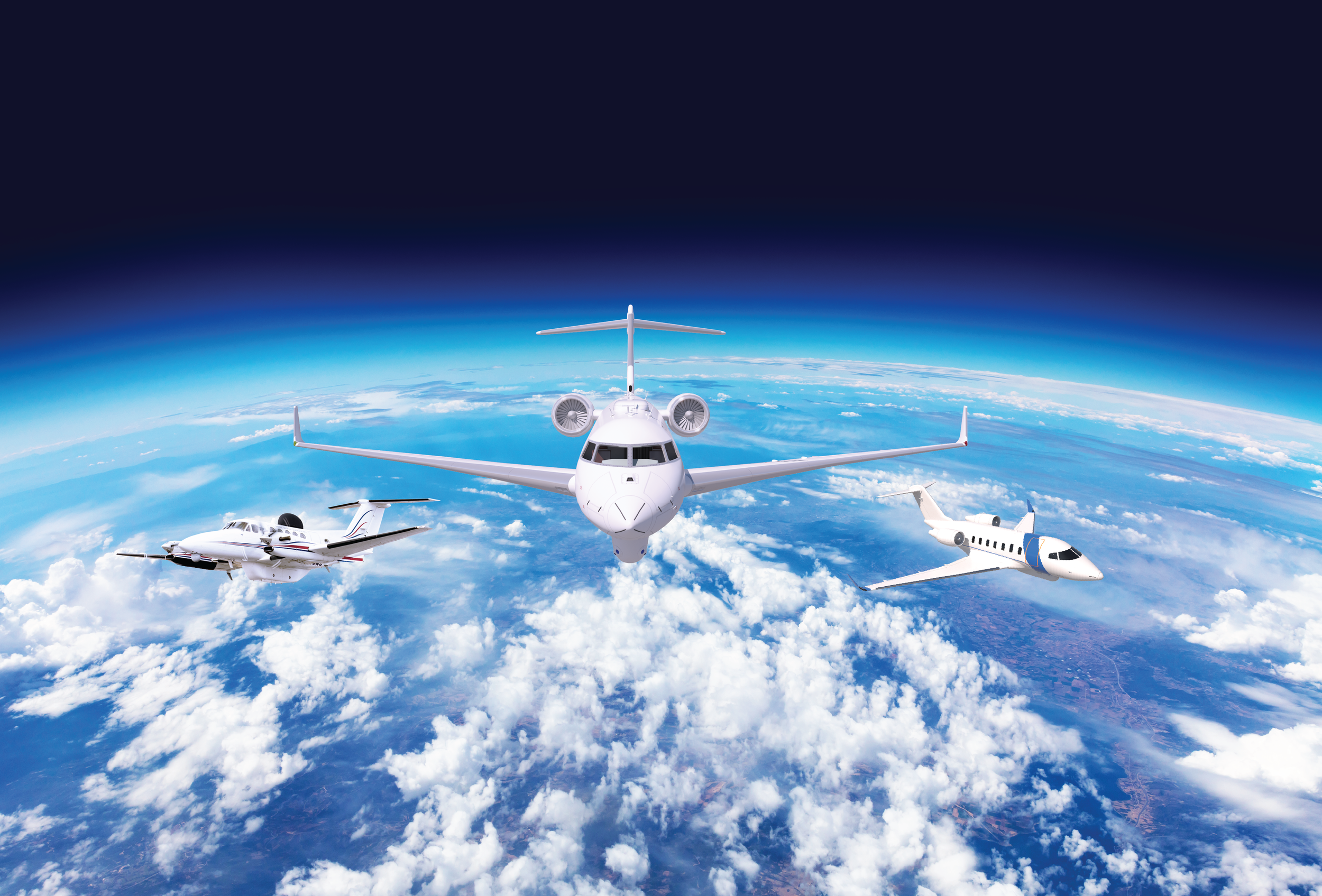 Scene above the clouds with three different ISR business jets.