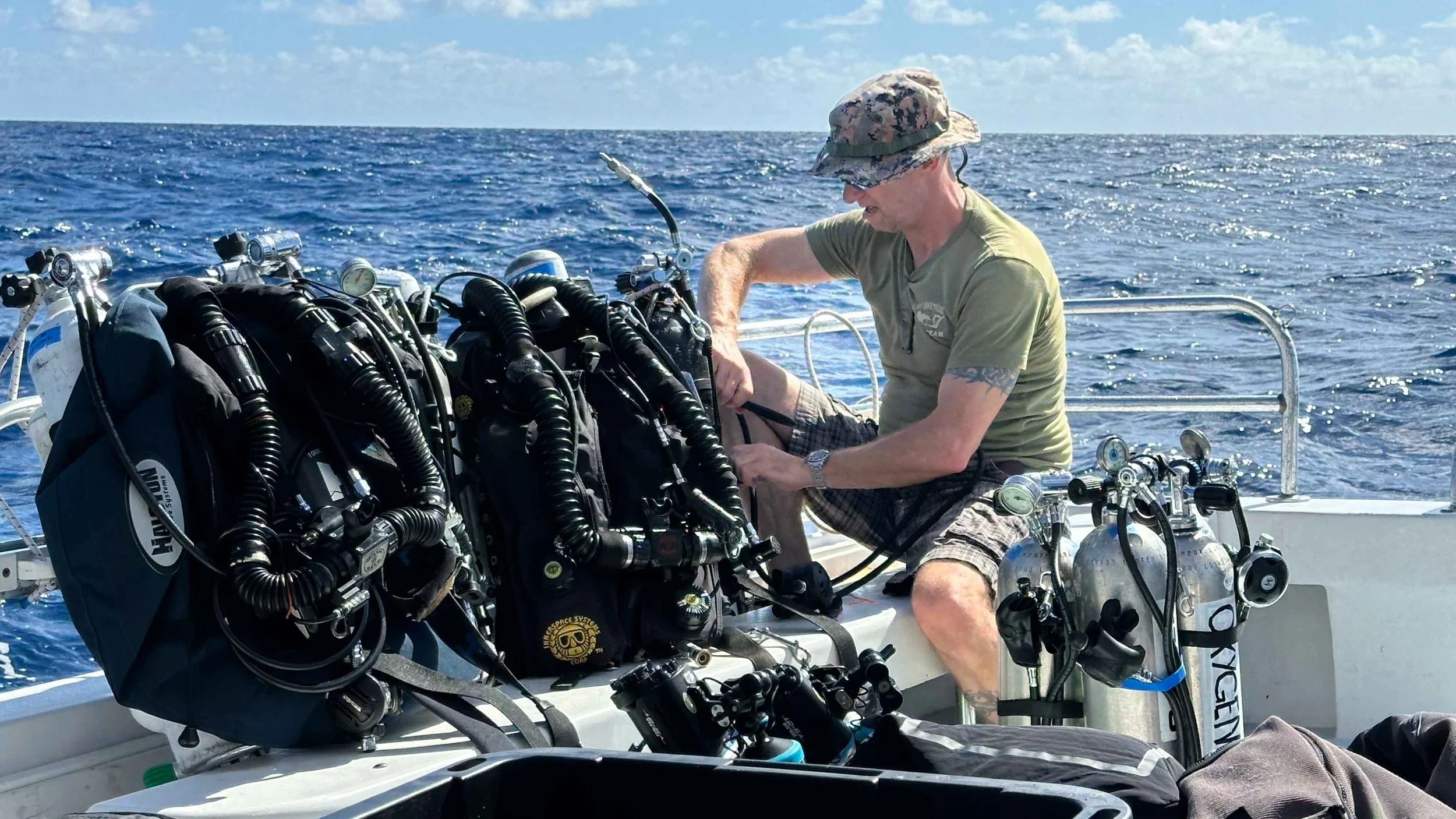 Rob DeProy, retired Coxswain of the Royal Canadian Navy’s Fleet Diving Unit (Pacific),
preparing his equipment for a dive on HMCS Canada.
