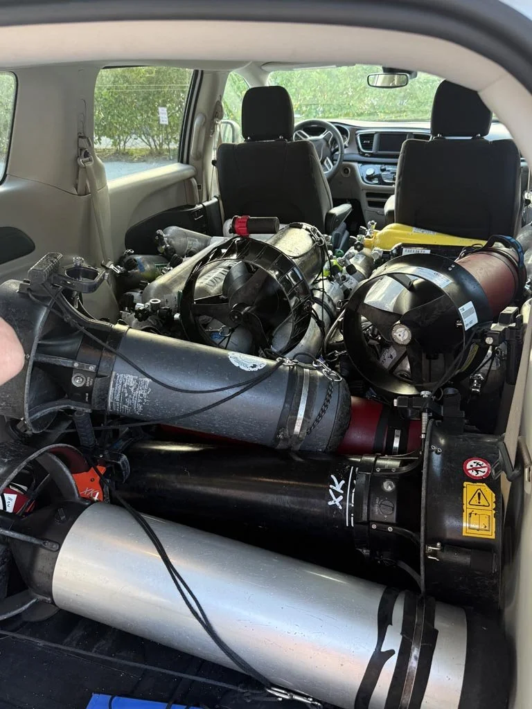 Diver Propulsion Vehicles (DPVs) and breathing-gas cylinders staged for the expedition’s technical dive team. Fully equipped, each technical diver carried approximately 300 pounds (136
kilograms) of equipment per dive.