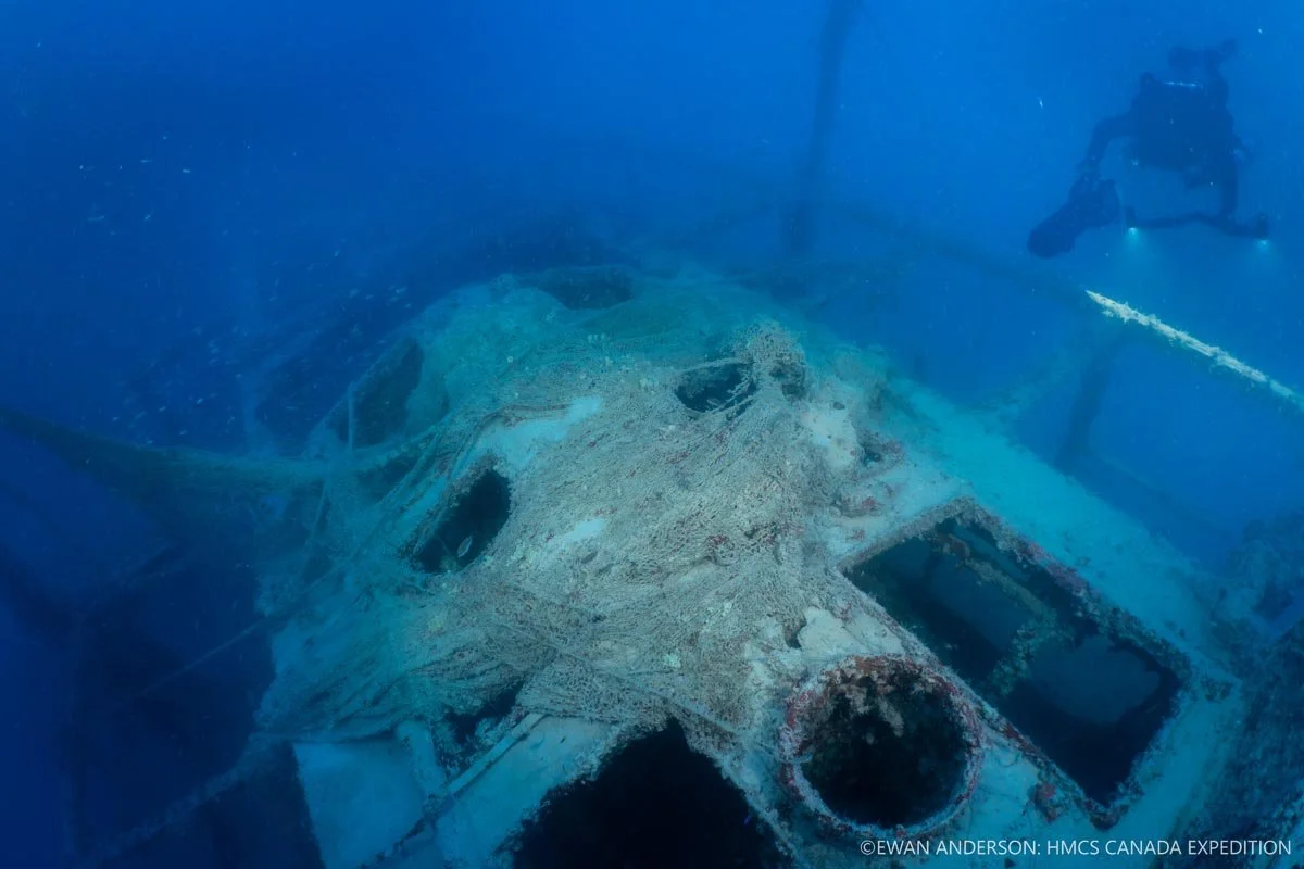 A decaying fishing net, entangled on the wreck for more than a quarter century, still covers part of the engine-room roof and skylights.