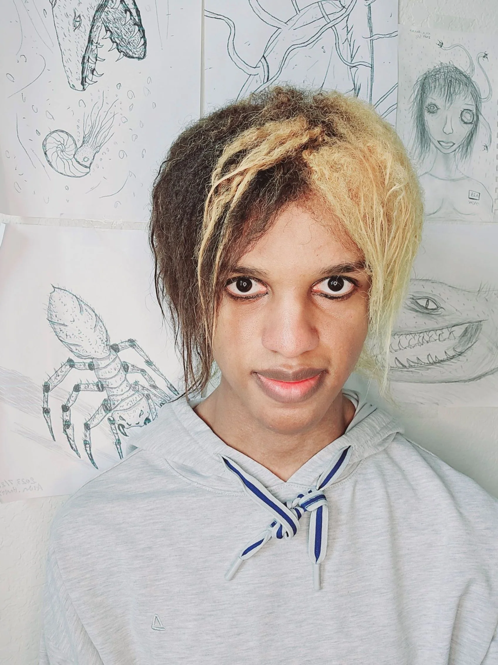 Artist Alan Hanley in front of Artwork