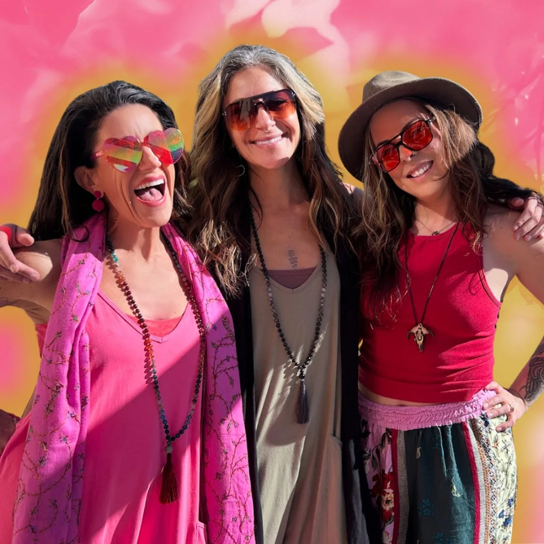 Three women standing together outdoors at transformational retreats & workshops in Colorado at Joytown.
