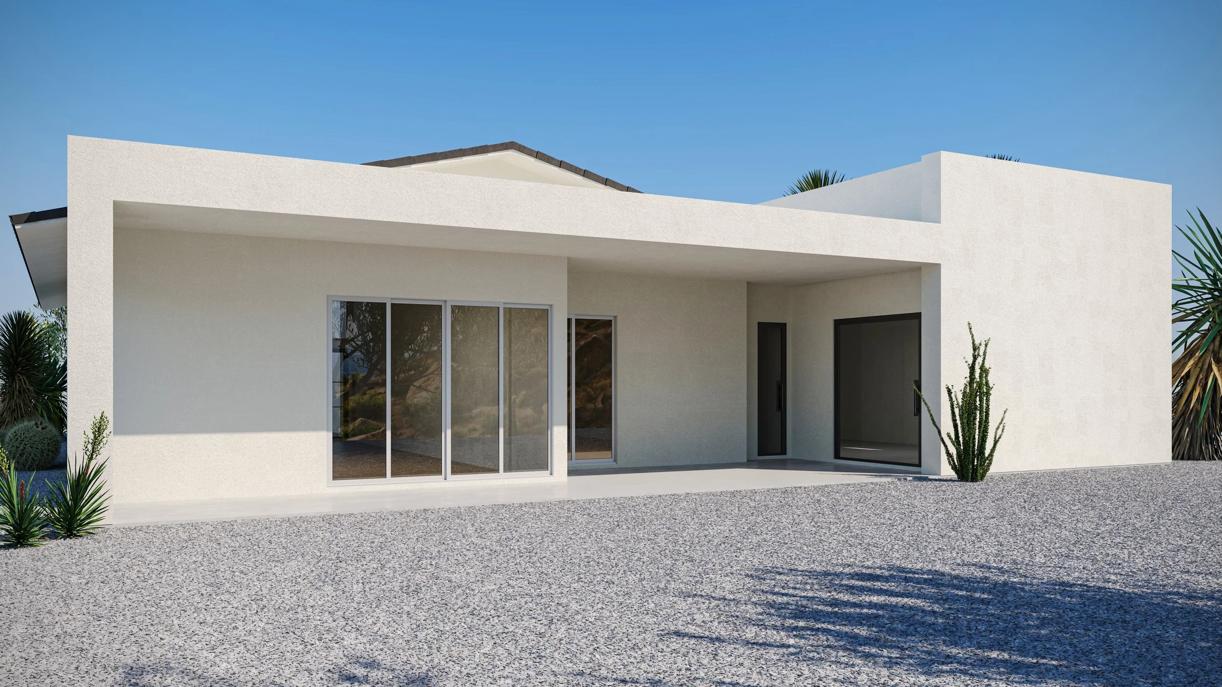 Modern white house with large sliding glass doors, desert landscaping with cacti, and a gravel yard under a clear blue sky.