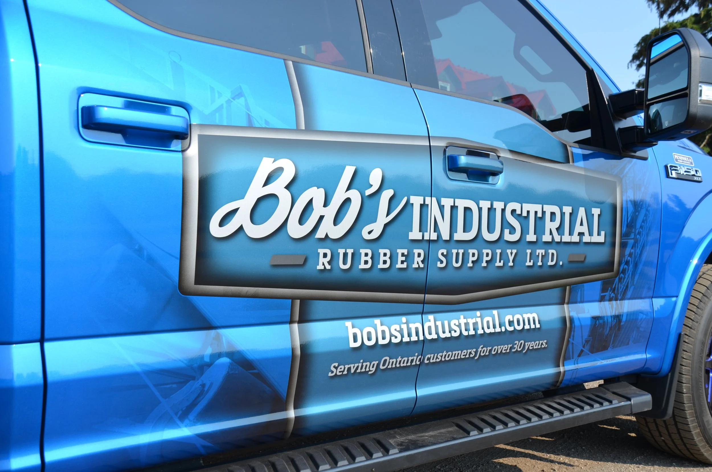 Bob's Industrial rubber supply Pickup truck wrap closeup