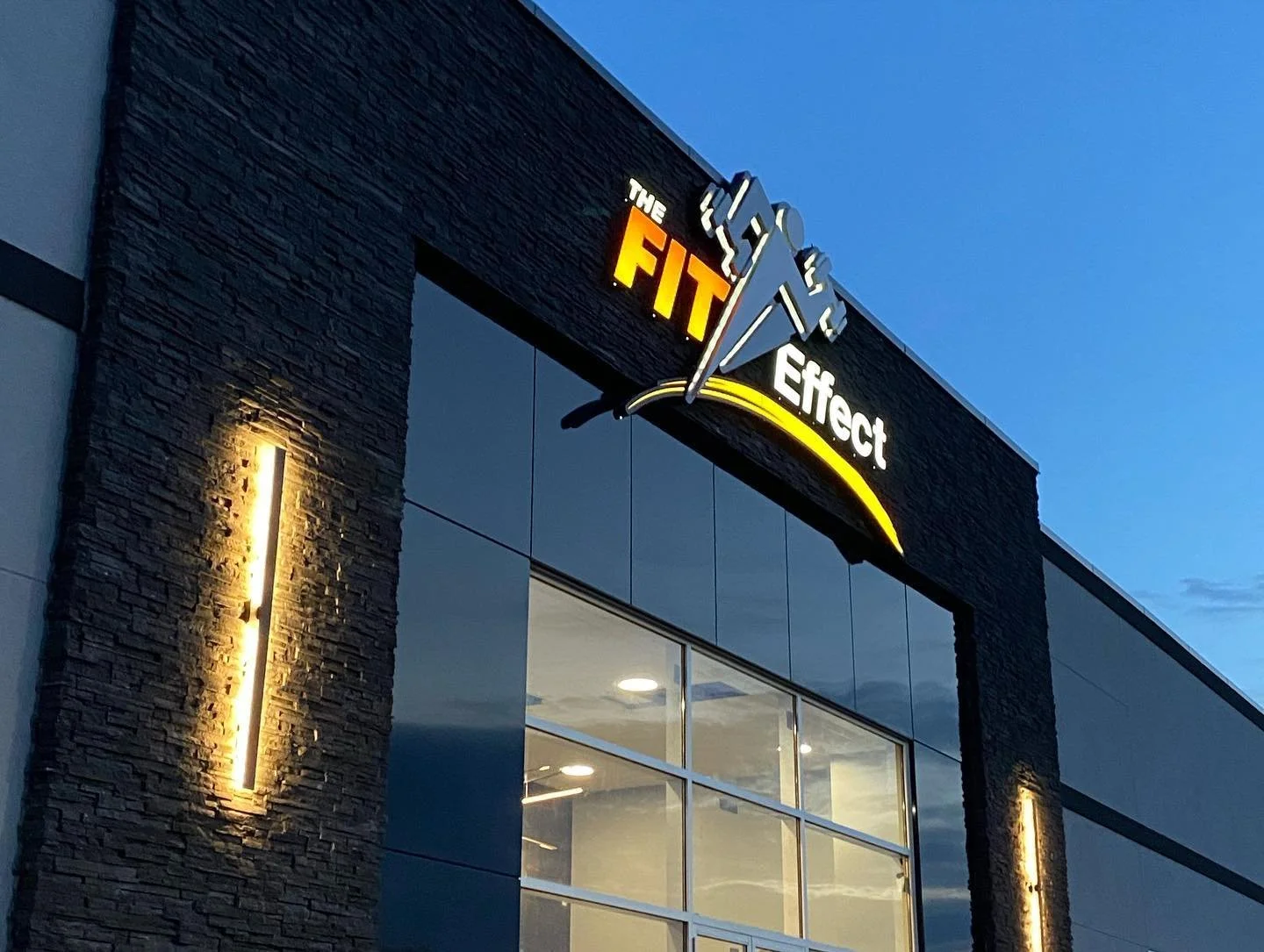Fit Effect exterior storefront custom formed metal backlit LED fascia sign at night
