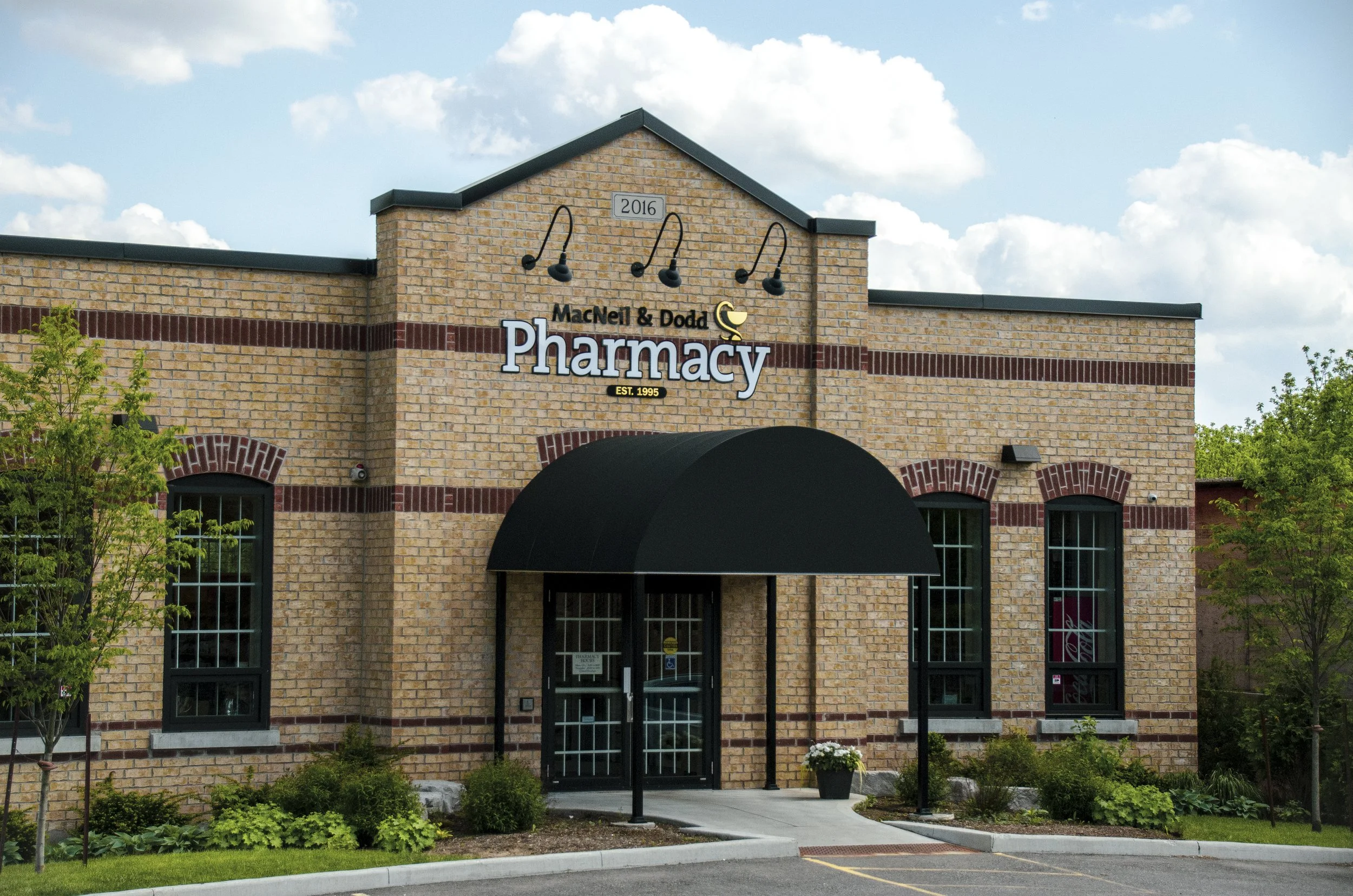 MacNeil & Dodd Pharmacy Exterior storefront sign
