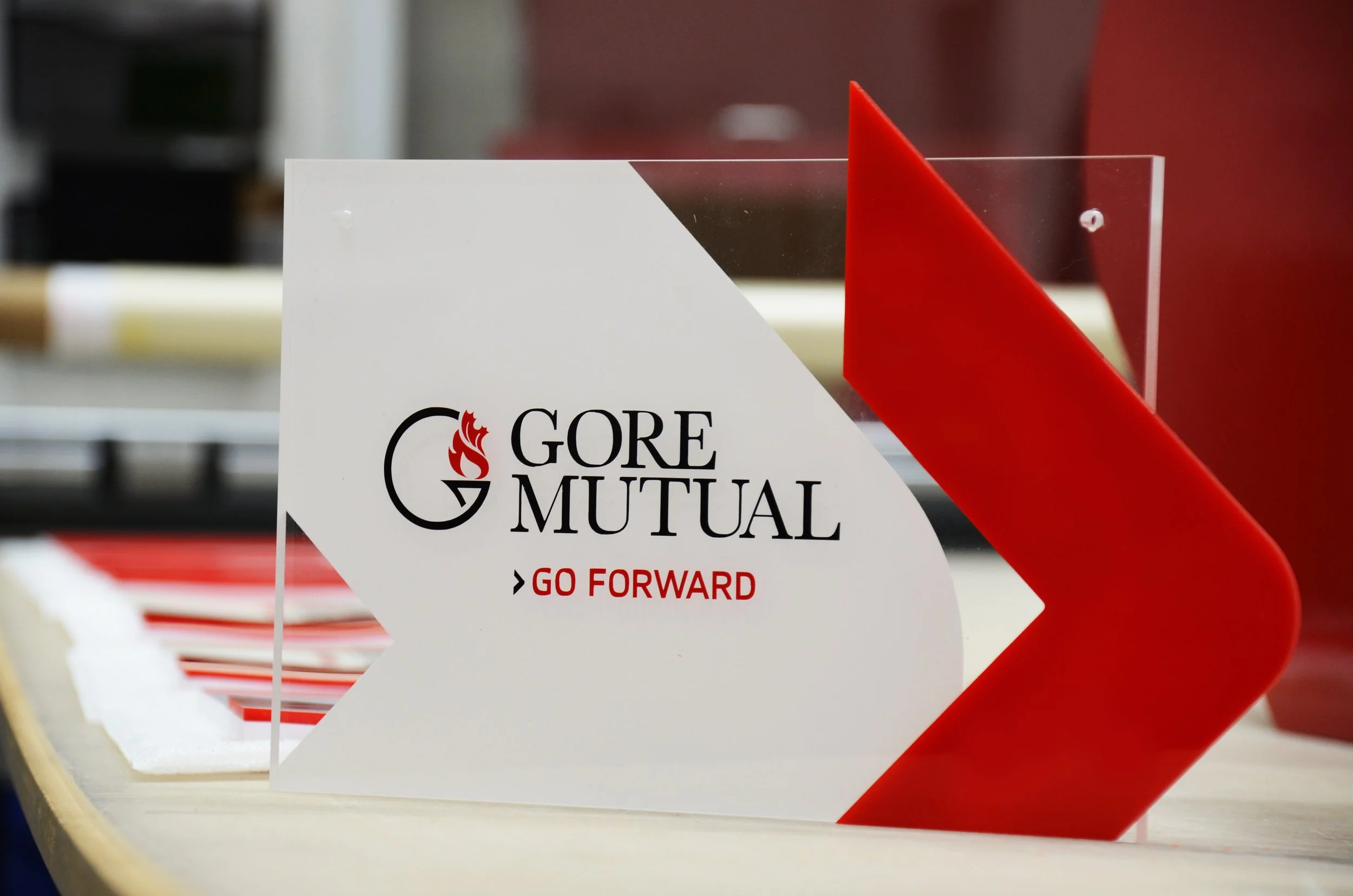 Interior Gore mutual acrylic wall mounted sign