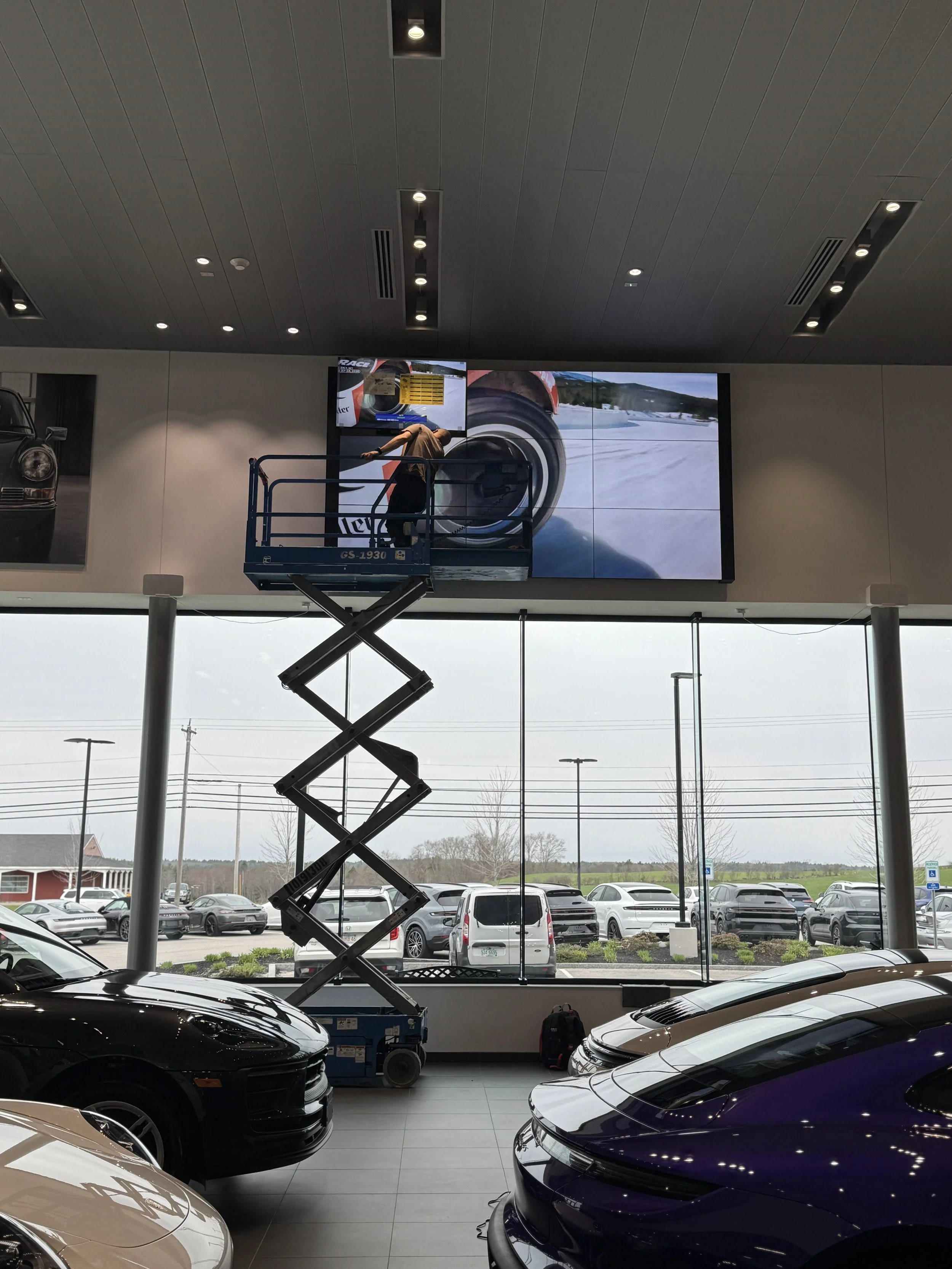 A large flat-screen digital display mounted on a wall.
