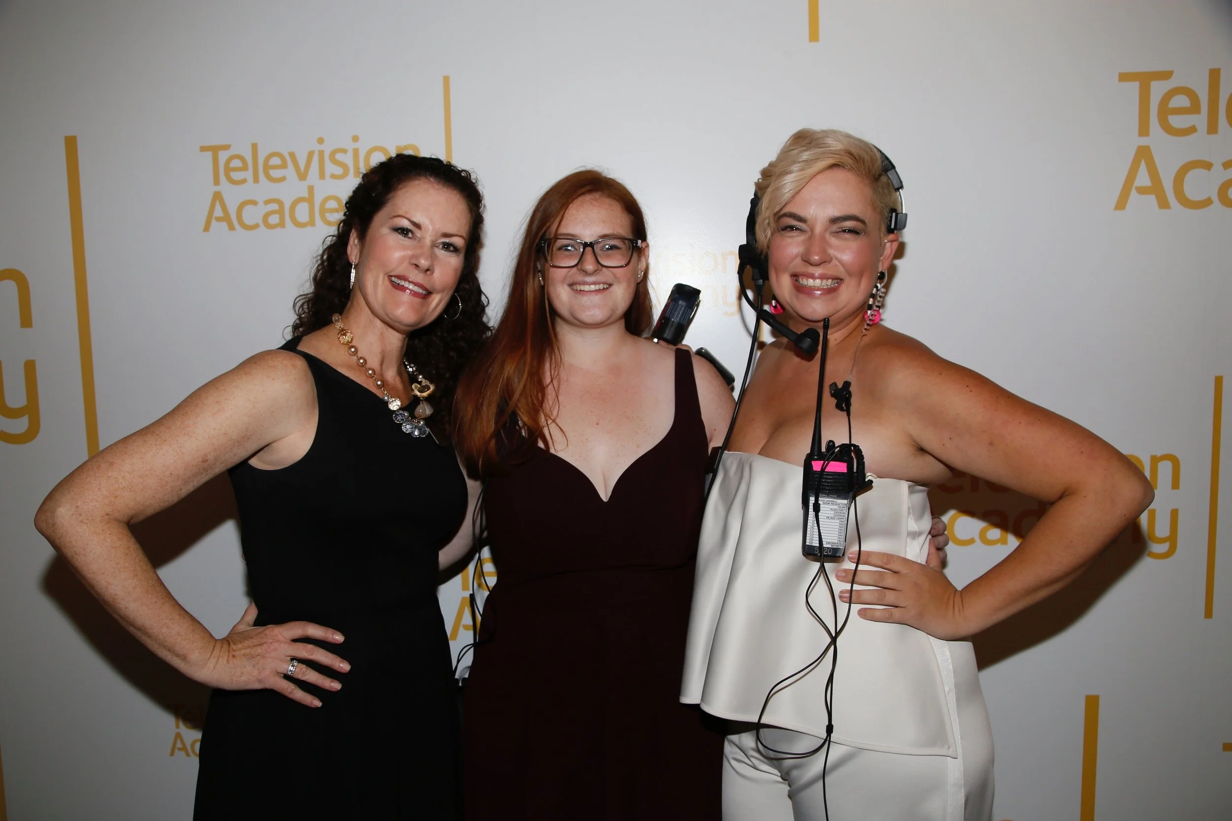Lindsay Scola posing with two colleagues at a Television Academy event.