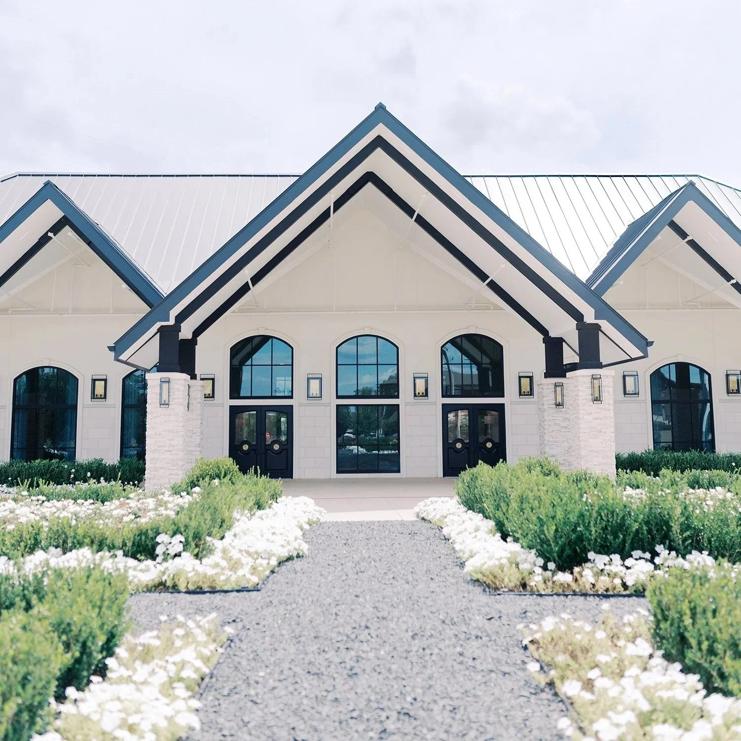 Exterior view of The Reserve at Marty B's wedding venue in Bartonville TX featuring manicured lawns and modern Southern architecture.