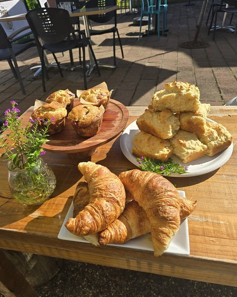 Lovely fresh baked goods. What a beautiful day by the river. Tables available today and through the weekend. Bug rolls are back!!!