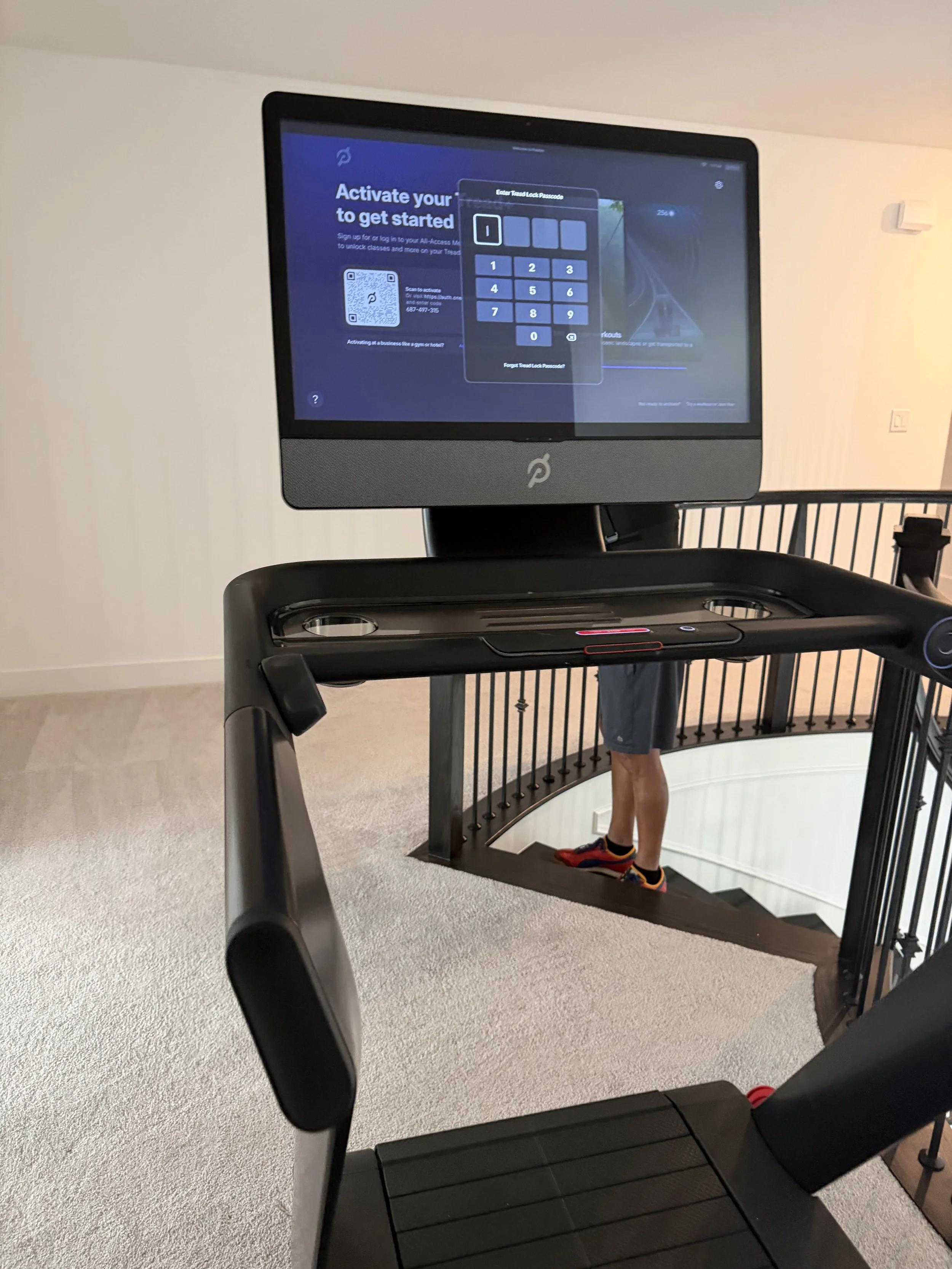 Peloton Tread Plus powered on for testing before relocation in a Houston home