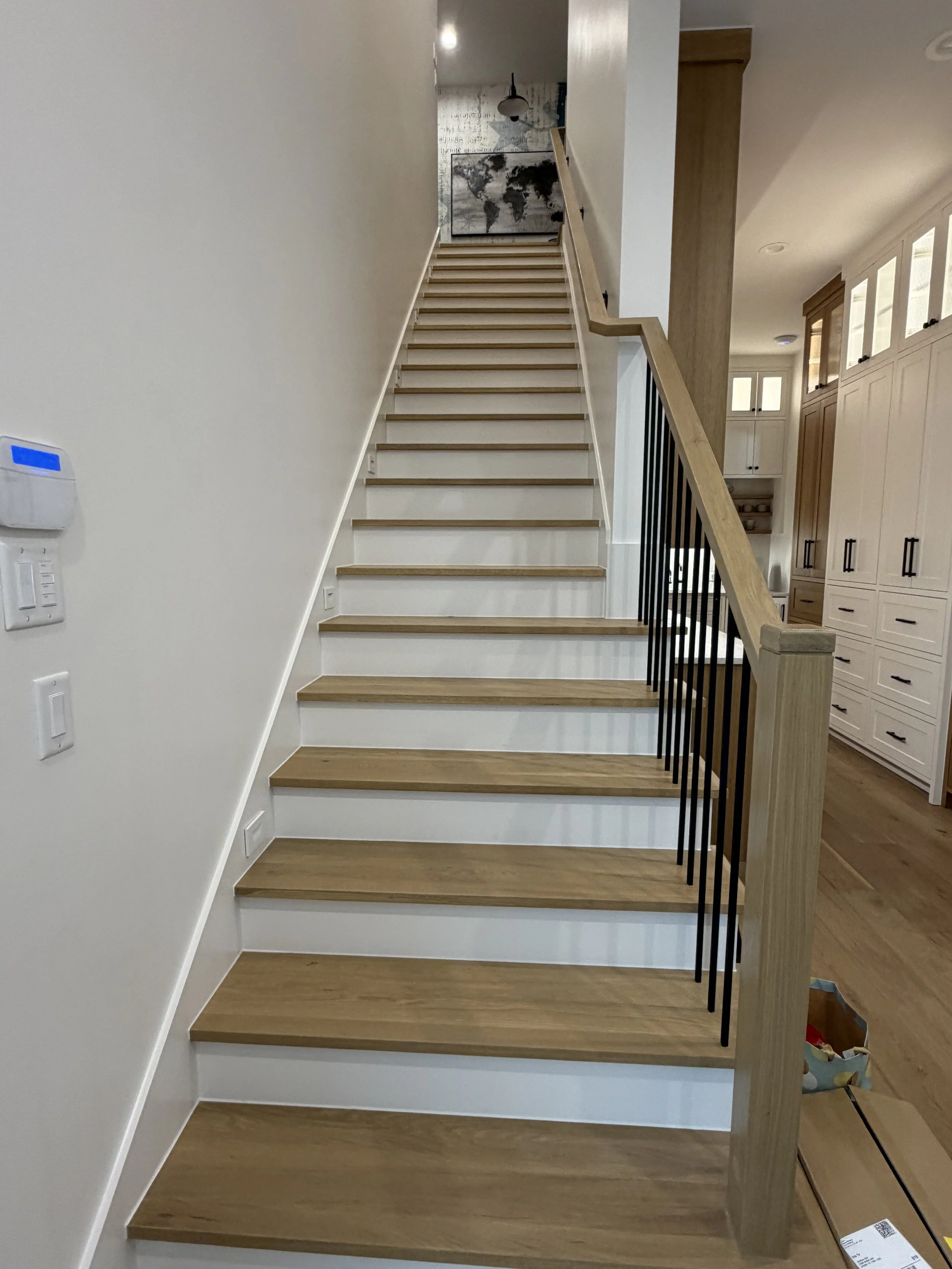 Hardwood staircase before moving Peloton Tread Plus to second-floor