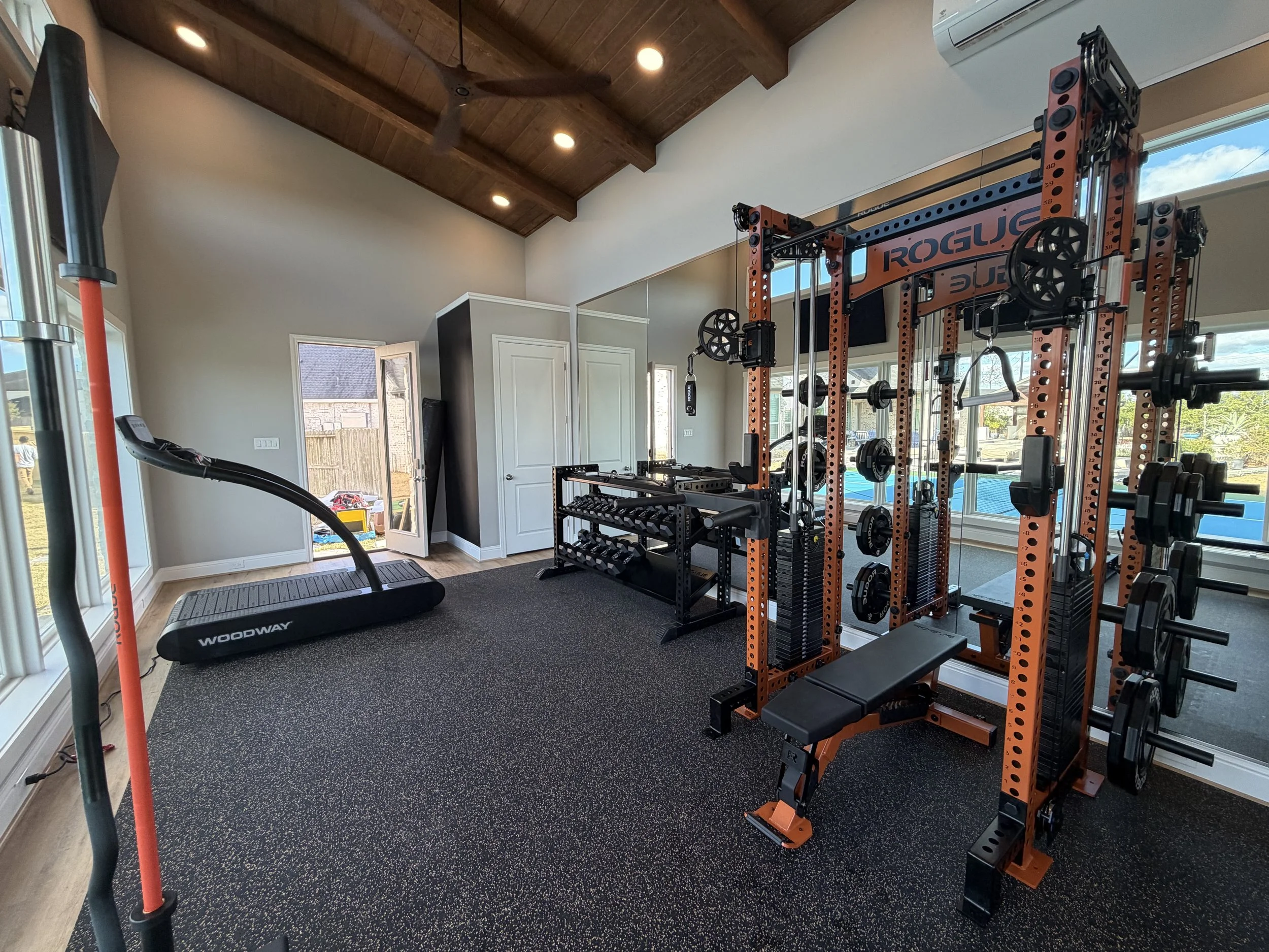 Rogue fitness woodway treadmill, Rogue fitness functional trainer and bench, Rogue fitness monster dumbbell rack with rogue fitness dumbbells