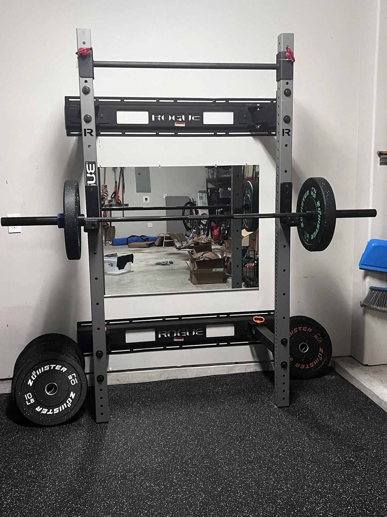 Rogue fitness wall-mounted power rack and mirror professional installation in Houston.