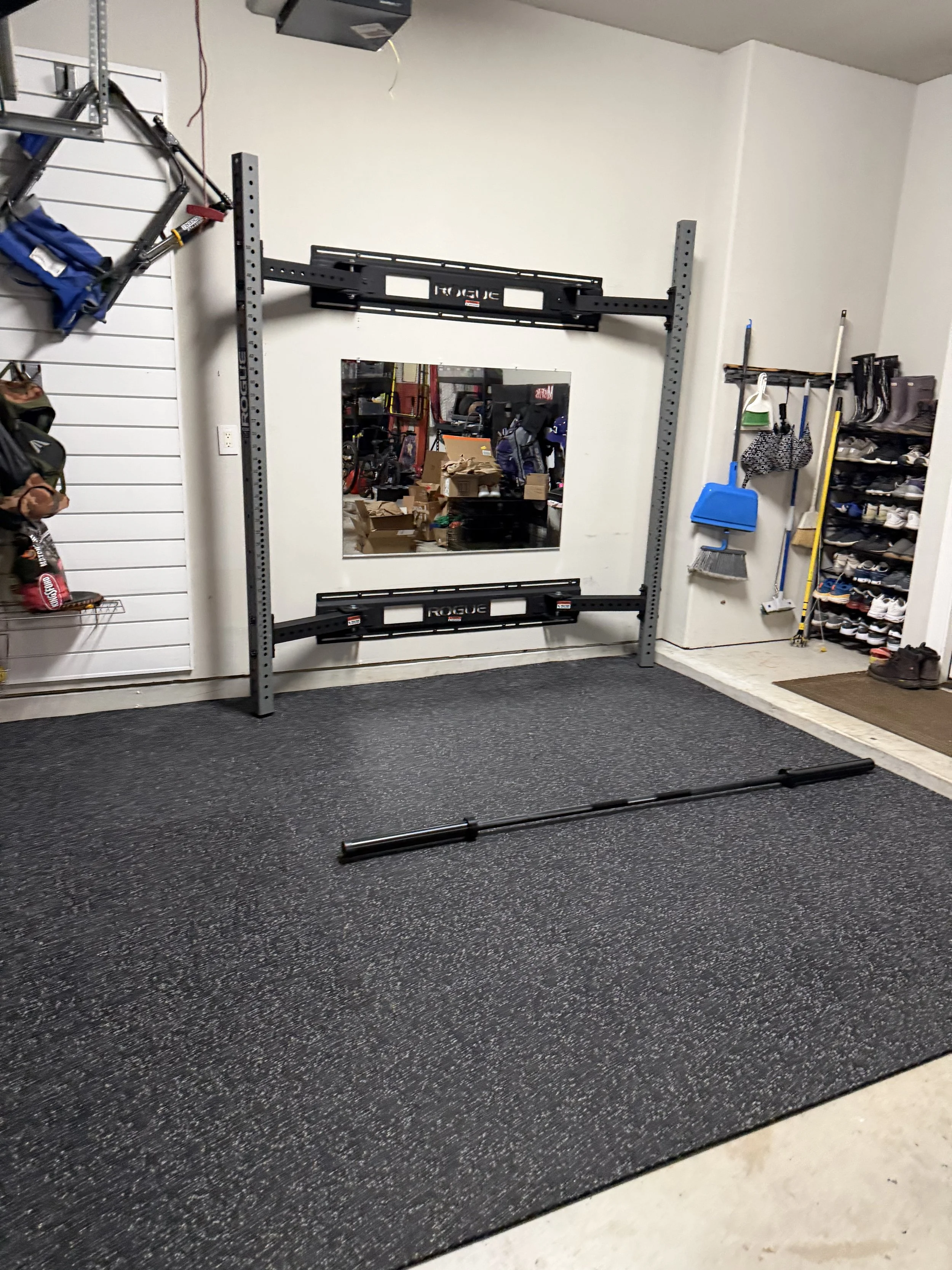 Rogue Fitness wall-mounted rack and mirror installation. Fulshear, TX