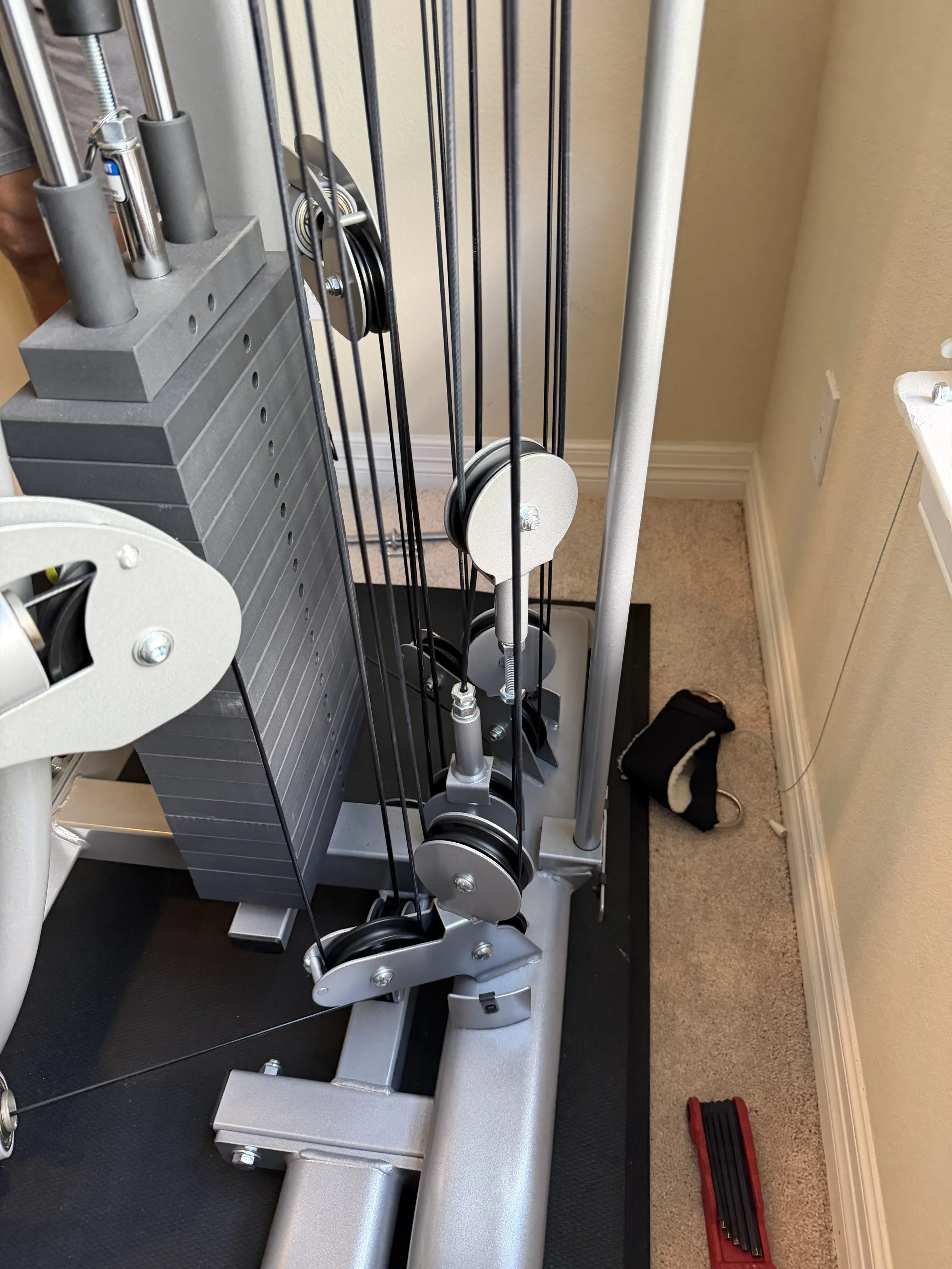 TuffStuff home gym cable machine before being professionally disassembled by Houston Gym Assembly.
