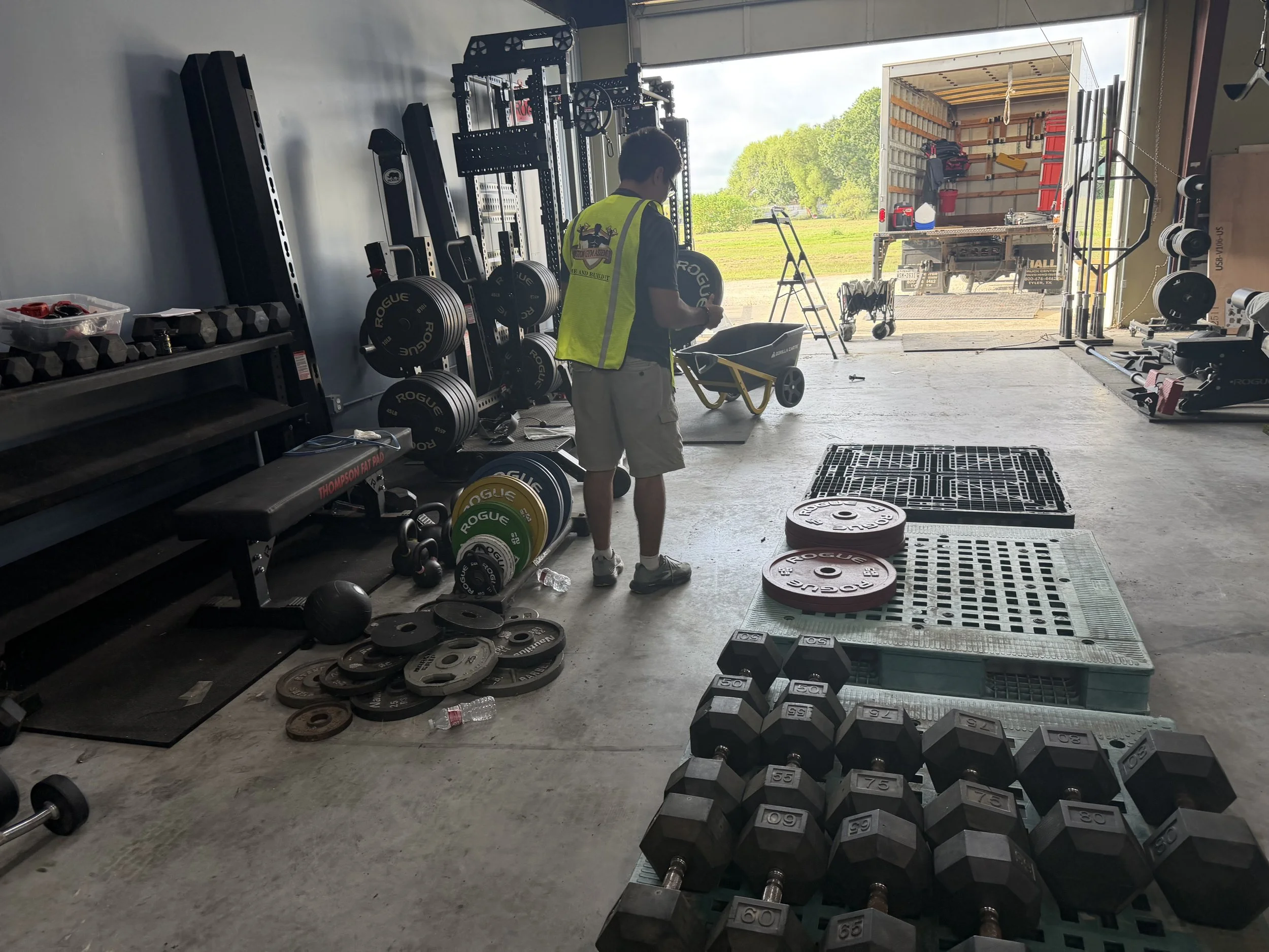 Houston Gym Assembly technician relocating commercial gym equipment, weights, and dumbbells for a gym move in Houston, TX