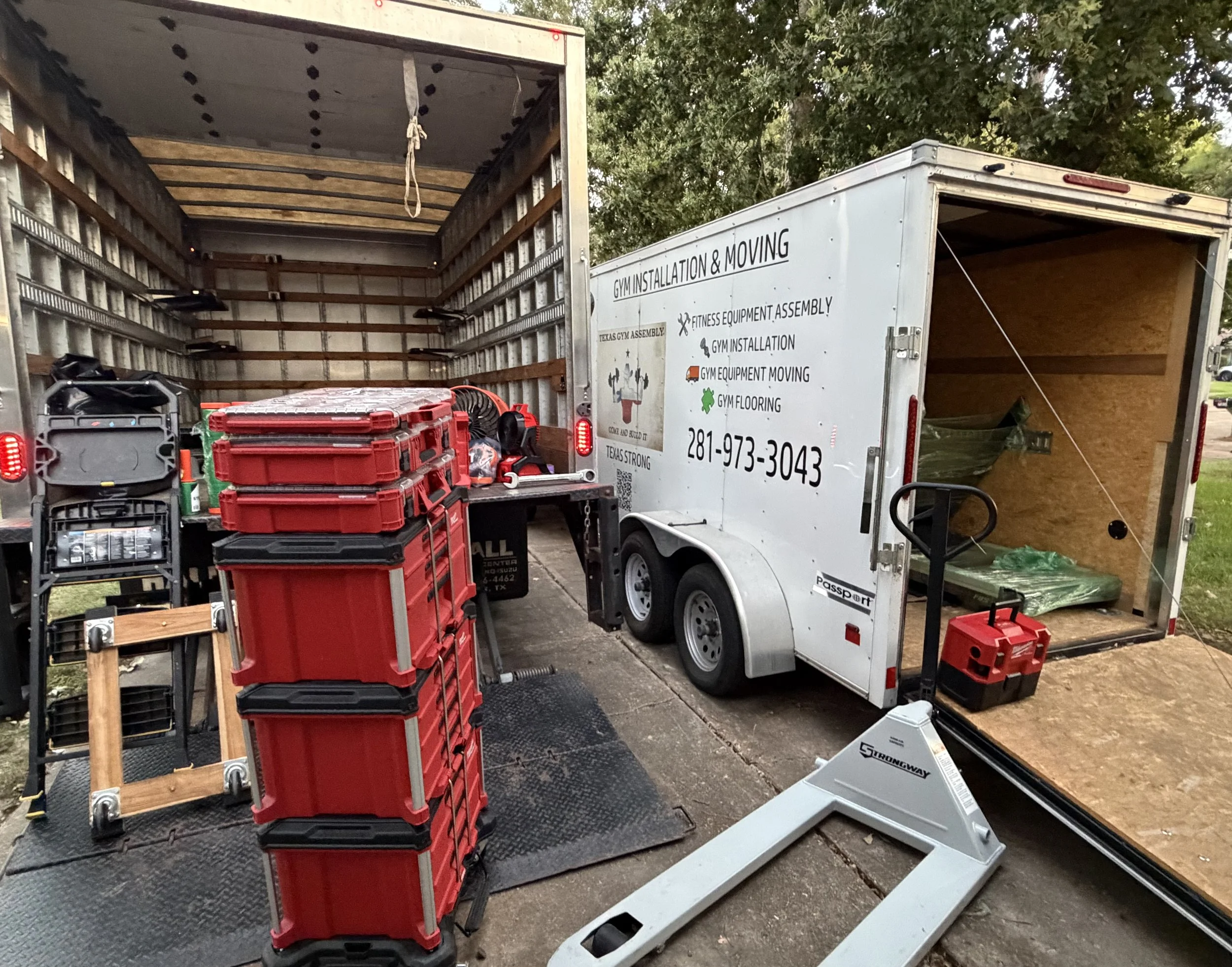 Houston Gym Assembly Truck and Trailer Preparing for Long Distance Gym Moving