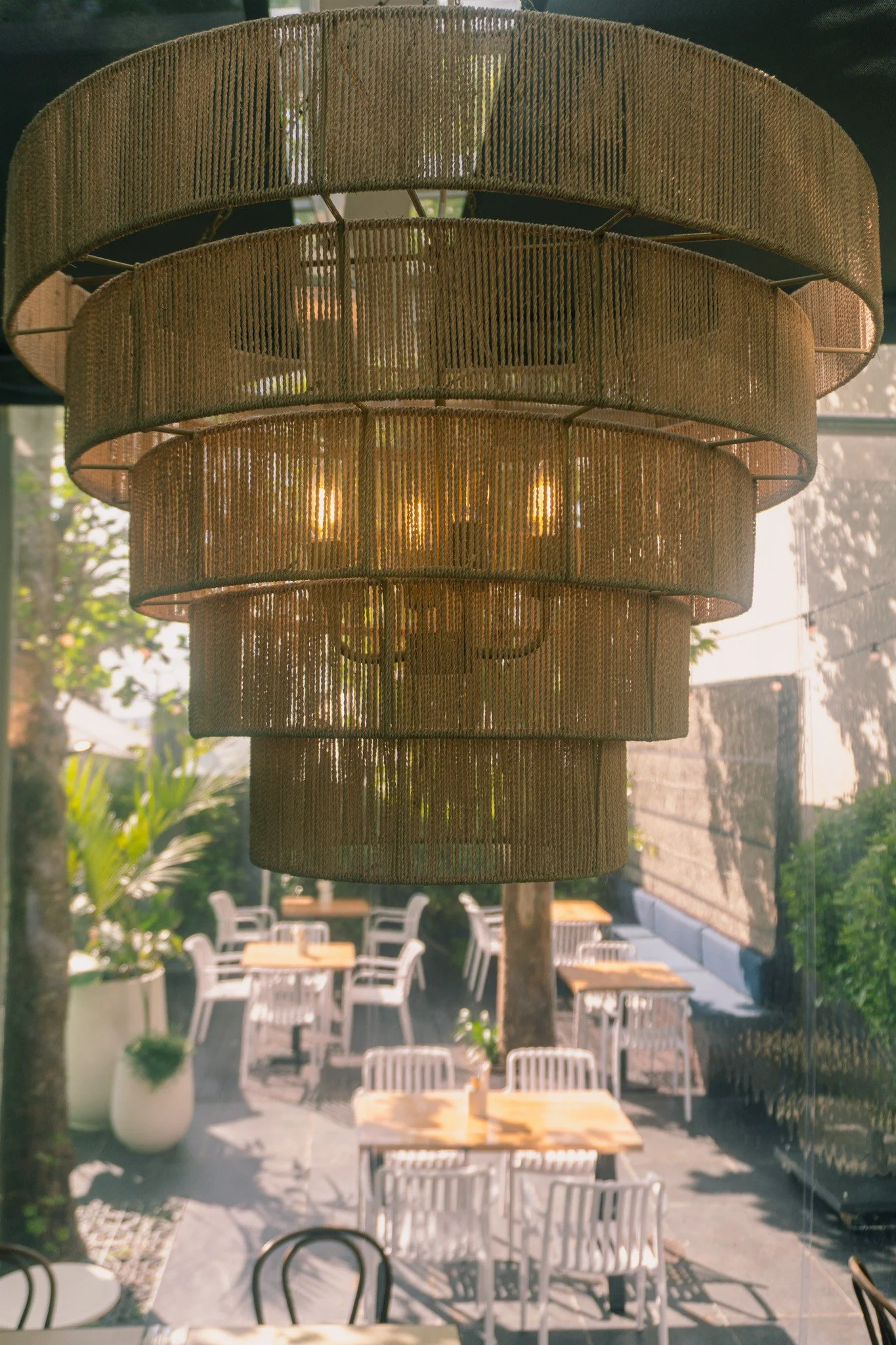 Rope chandelier over the outdoor patio seating at Meadow