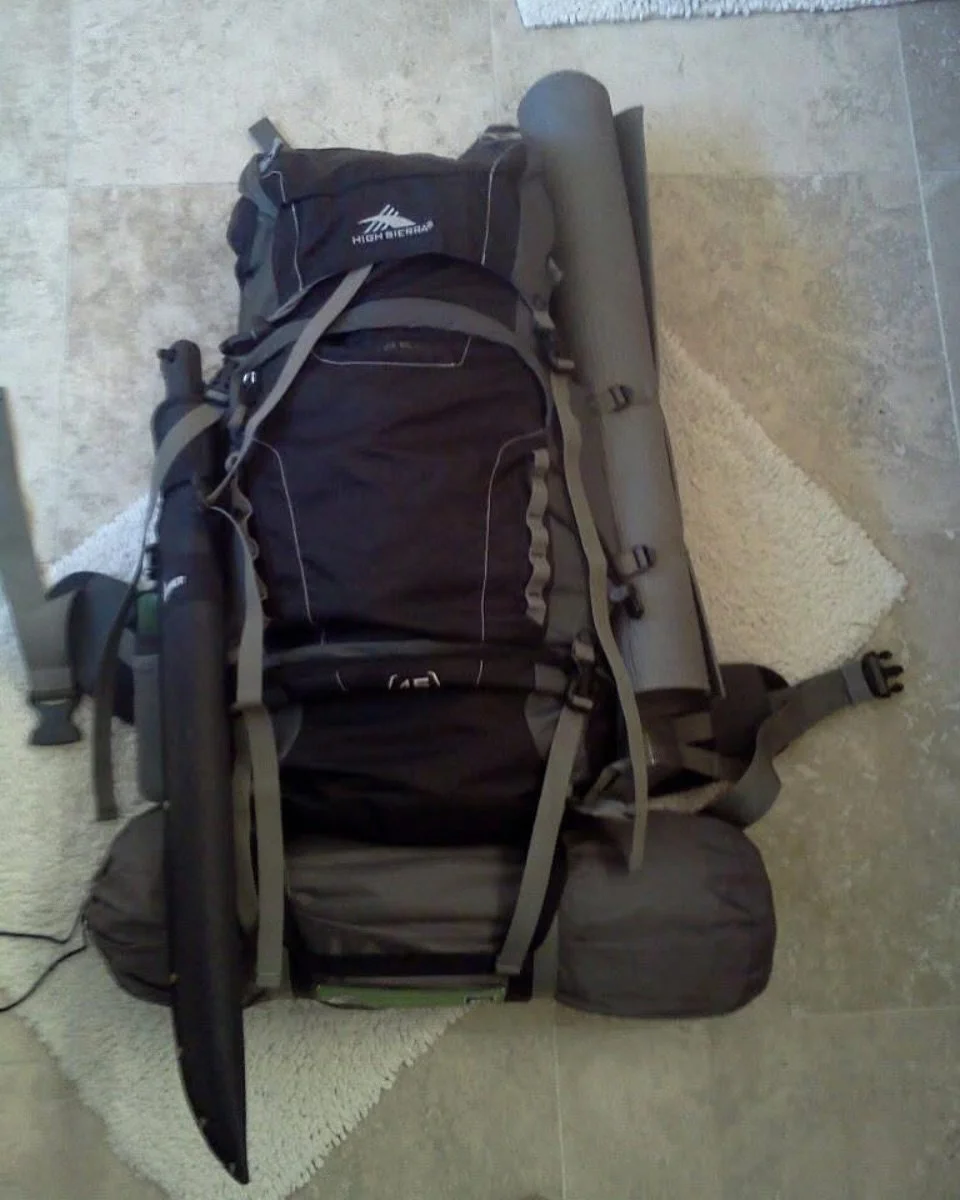 My first pack from 12 years ago.
I slept on that cheap yoga mat strapped to the side of my Costco purchased pack for two nights. The quarter inch thick slab of rubber provided neither comfort nor warmth. I was so weighed down with superfluous gear