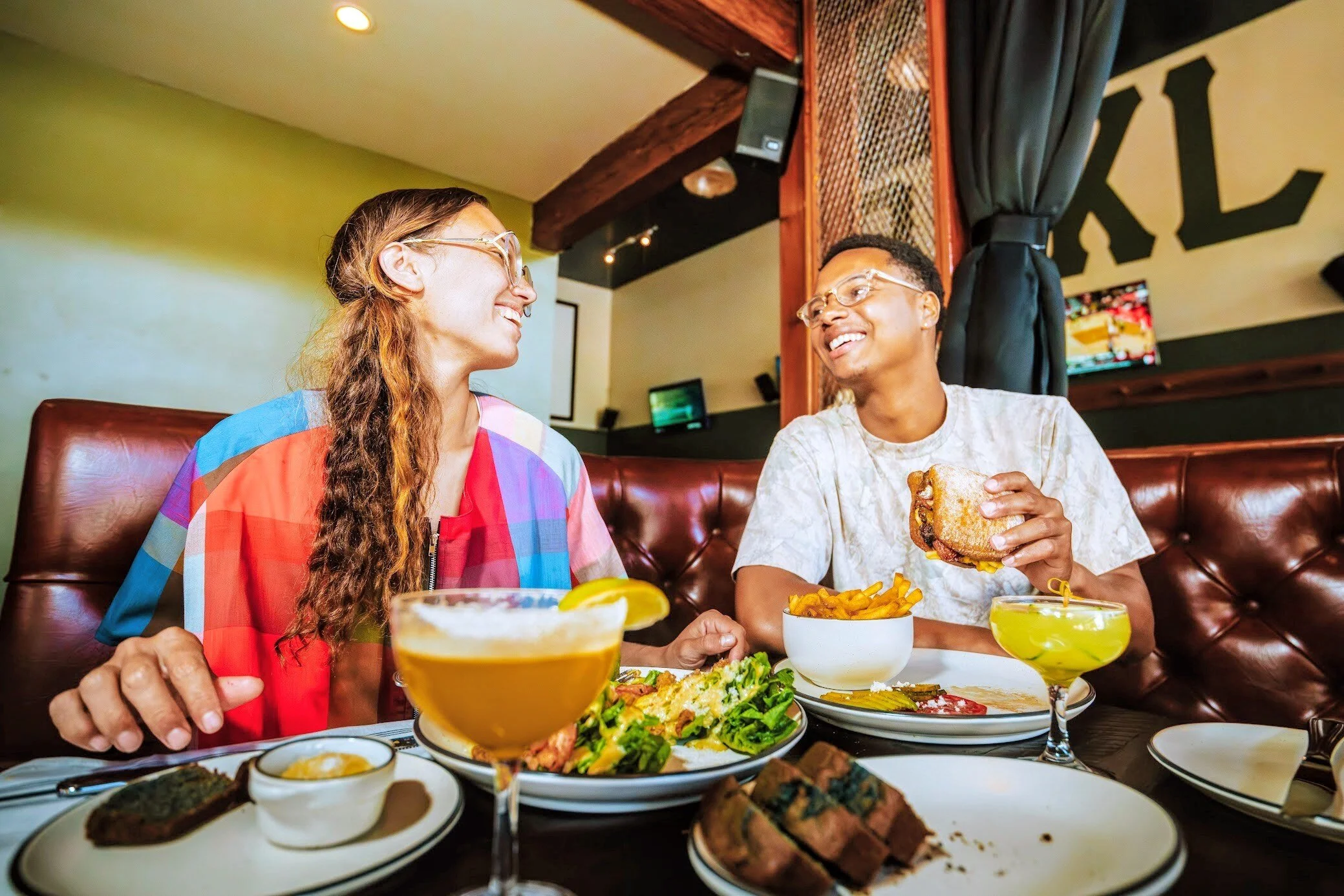friends happily sharing a meal together at the restaurant