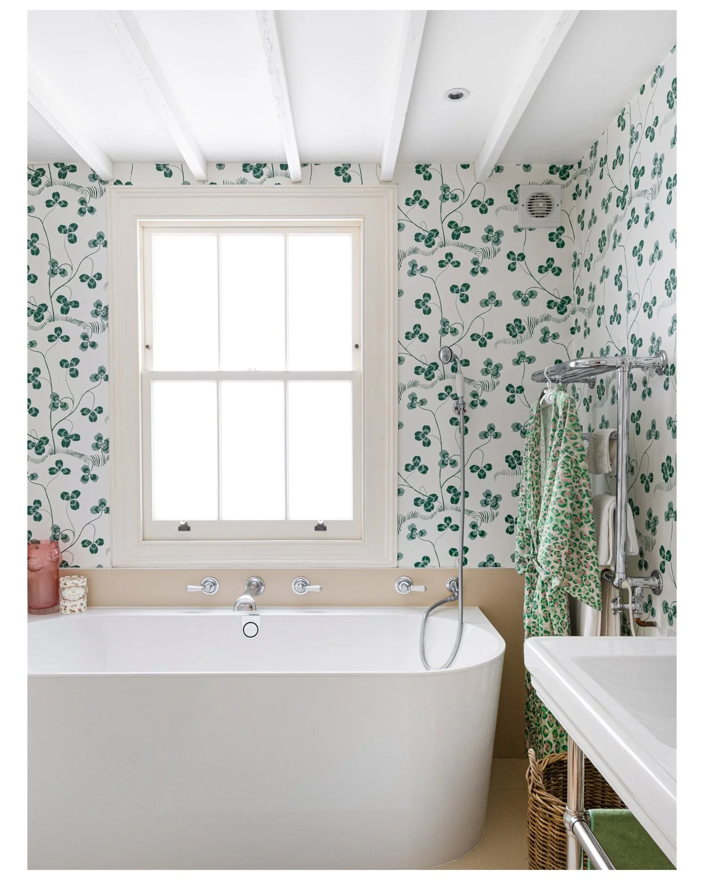 Not your average Putney house. Swipe to see why. &rarr;

Slide 1 &mdash; Bathroom, botanical wallpaper, freestanding bath
Bold wallpaper. Freestanding bath. A bathroom that makes a statement.

Slide 2 &mdash; Bedroom, yellow curtains, walnut chest
Su