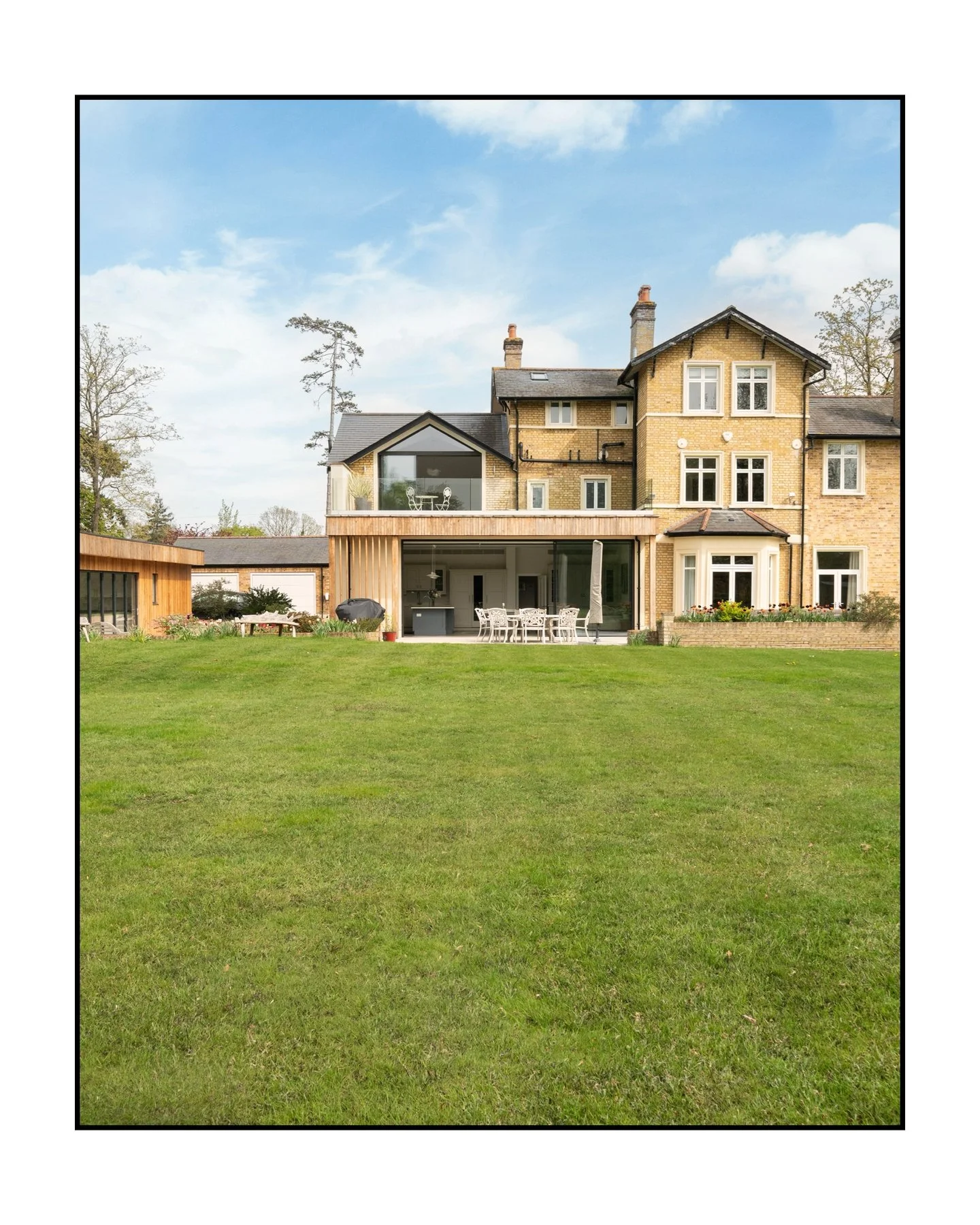 Discover a stunning Victorian manor in Surrey that just keeps getting better. ⬇️

Slide 1 &mdash; Rear elevation with cedar extension, manicured lawns, and a roof terrace.

Slide 2 &mdash; Commanding front elevation with a gated gravel drive.

Slide 