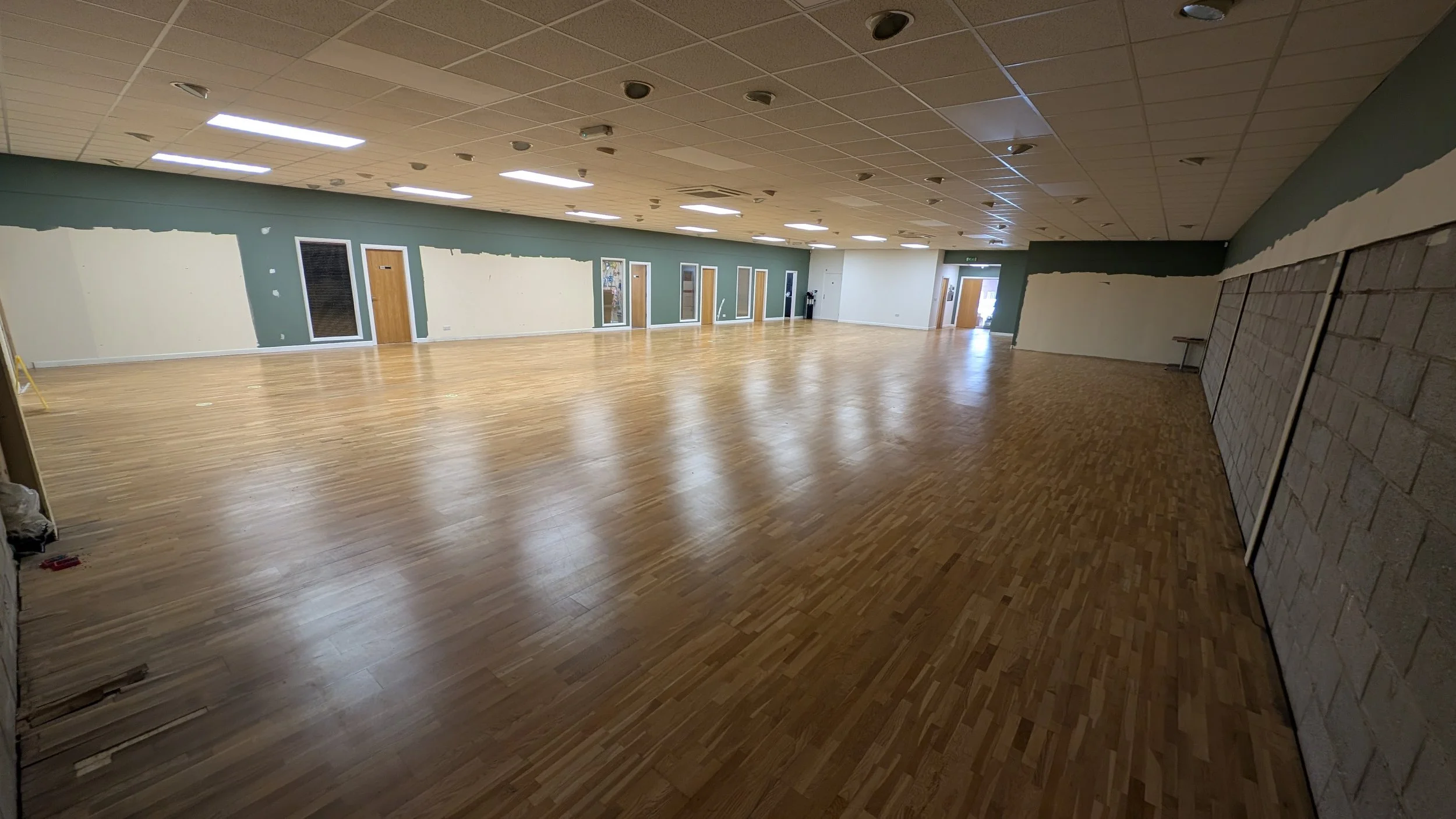 Commercial wood floor before sanding and refinishing